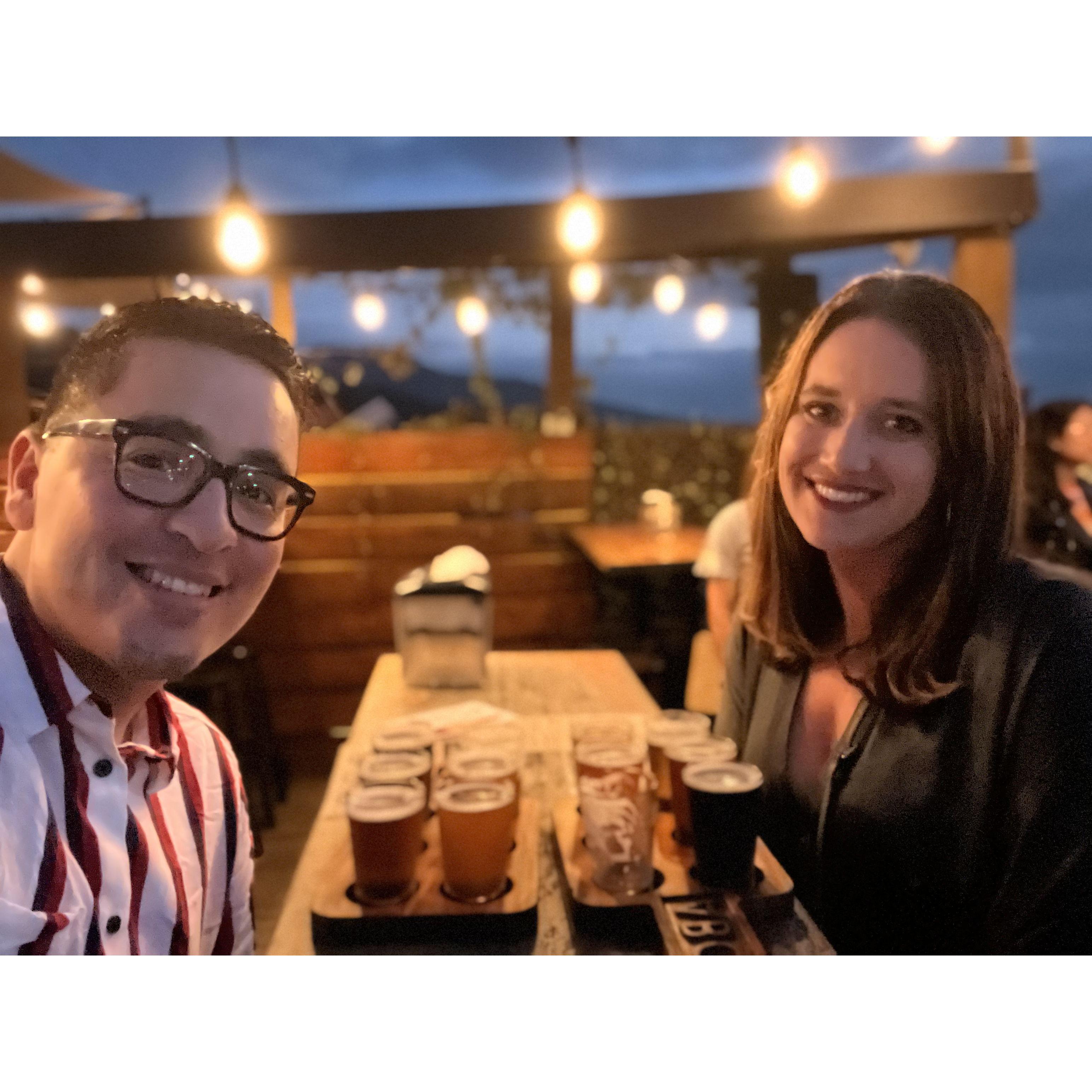 Enjoying a flight of craft beers at Antigua Brewing Company in Antigua, Guatemala.