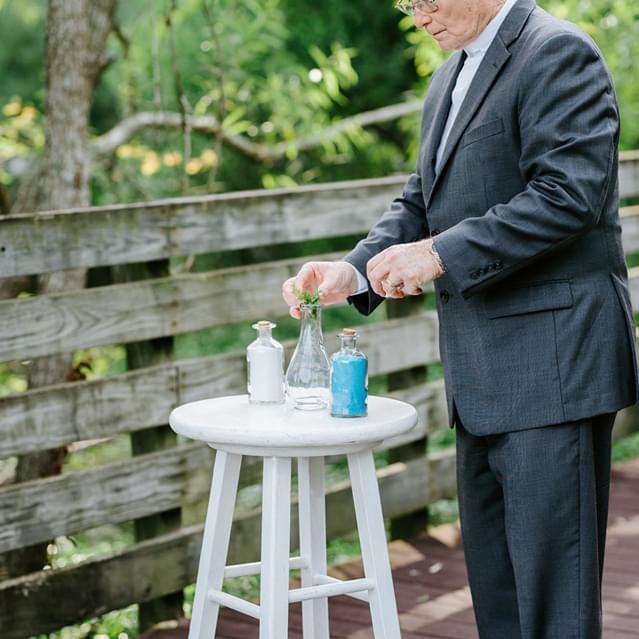 Pastor setting up the sand for the ceremony