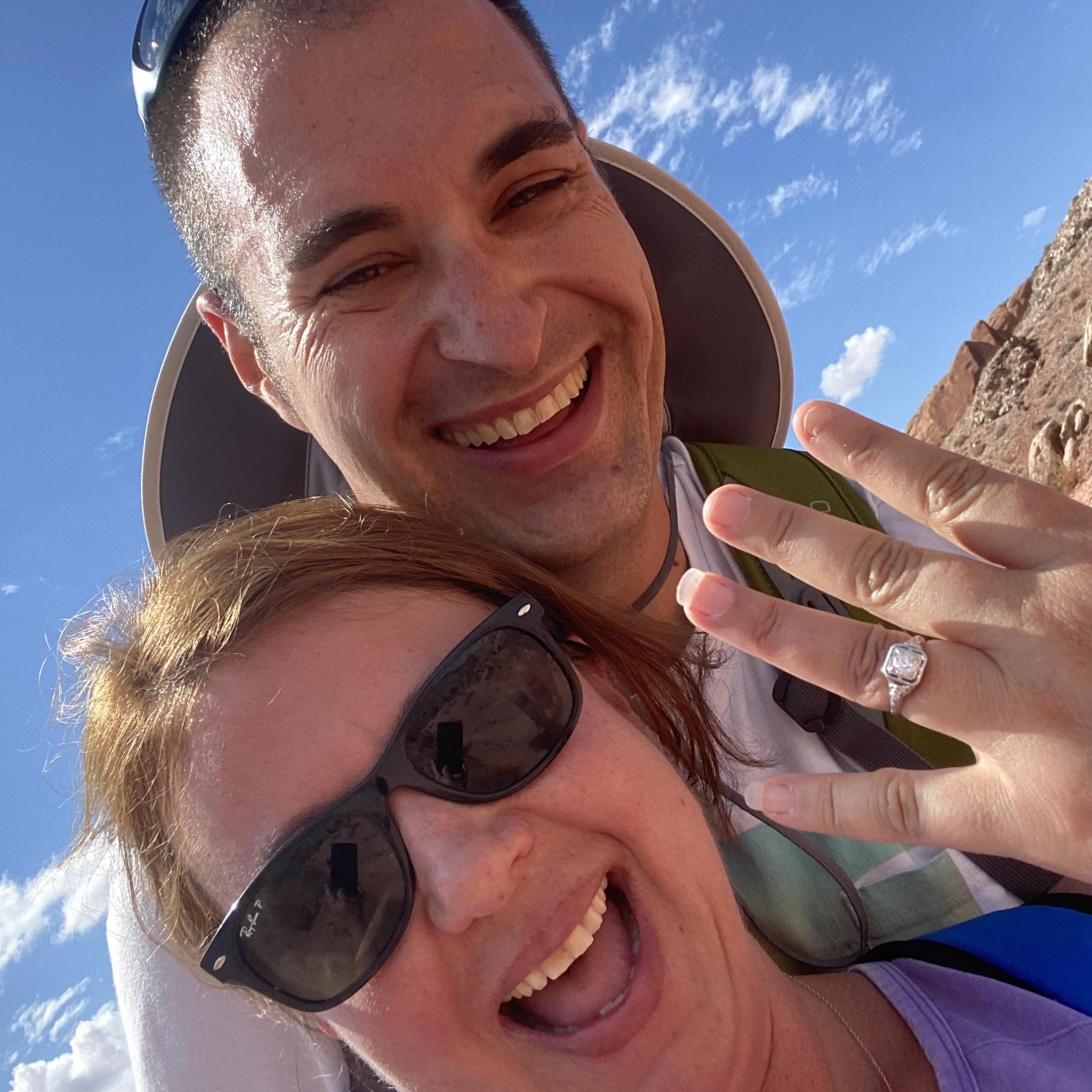 Hot, sweaty, and most likely complaining....he proposed at Arches National Park