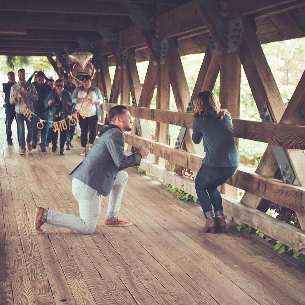 Travis still waiting for an answer as Katlyn starts to recognize the people walking towards her on the bridge