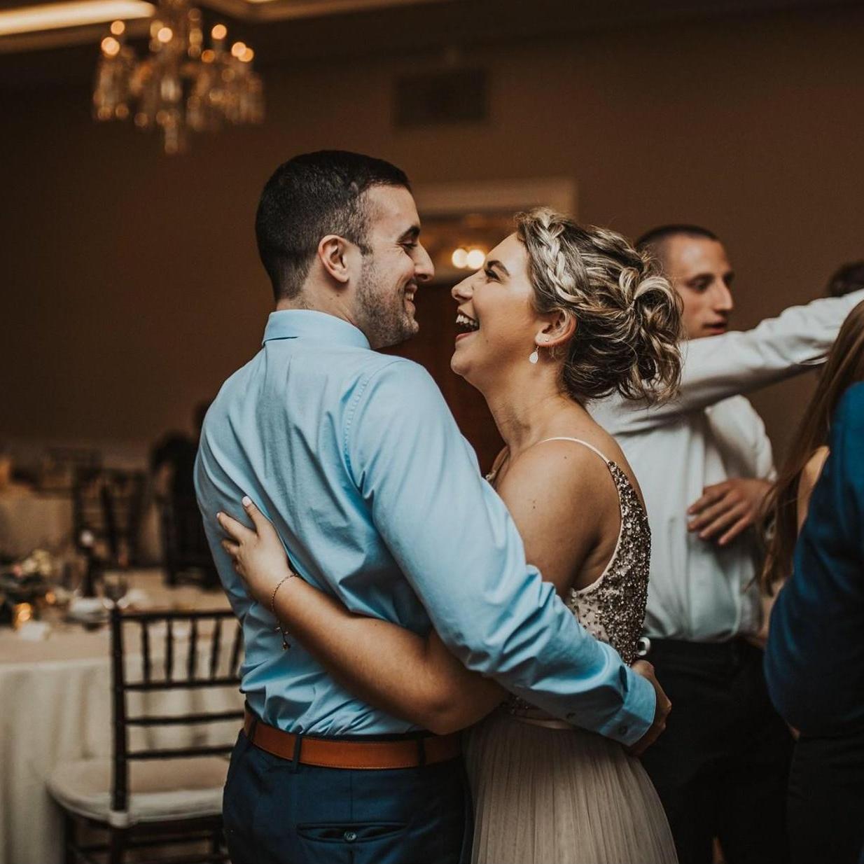 Enjoying a friend's wedding together.