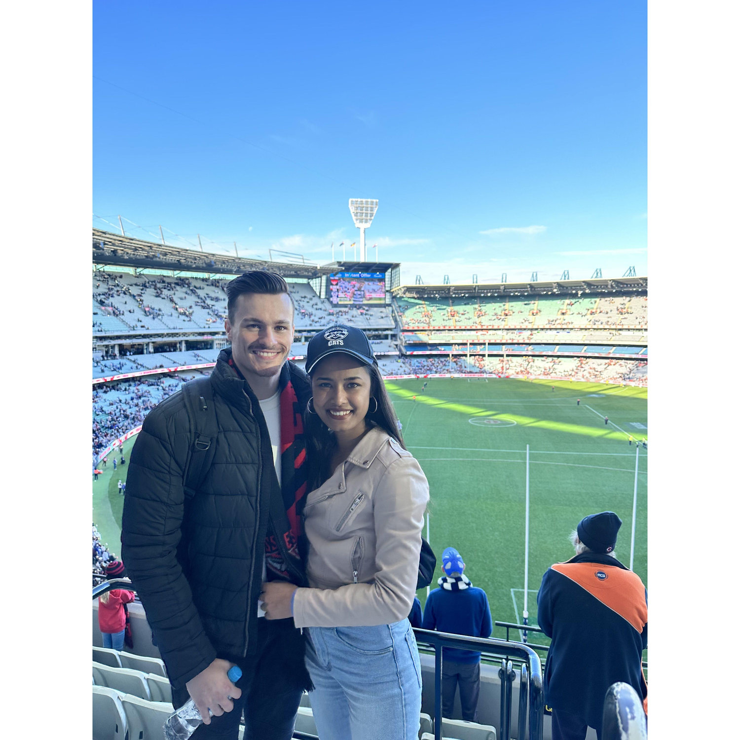 Our first live AFL game together, and Tyler gave it his best shot trying to convert Soni into an Essendon supporter—let's just say, it didn't quite work out!