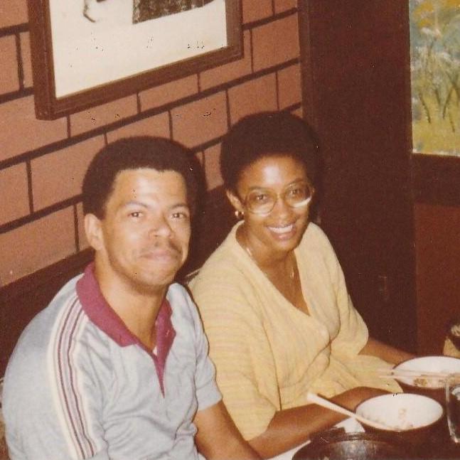 In a Japanese restaurant, practicing using chopsticks and sitting on the floor (early 80s).