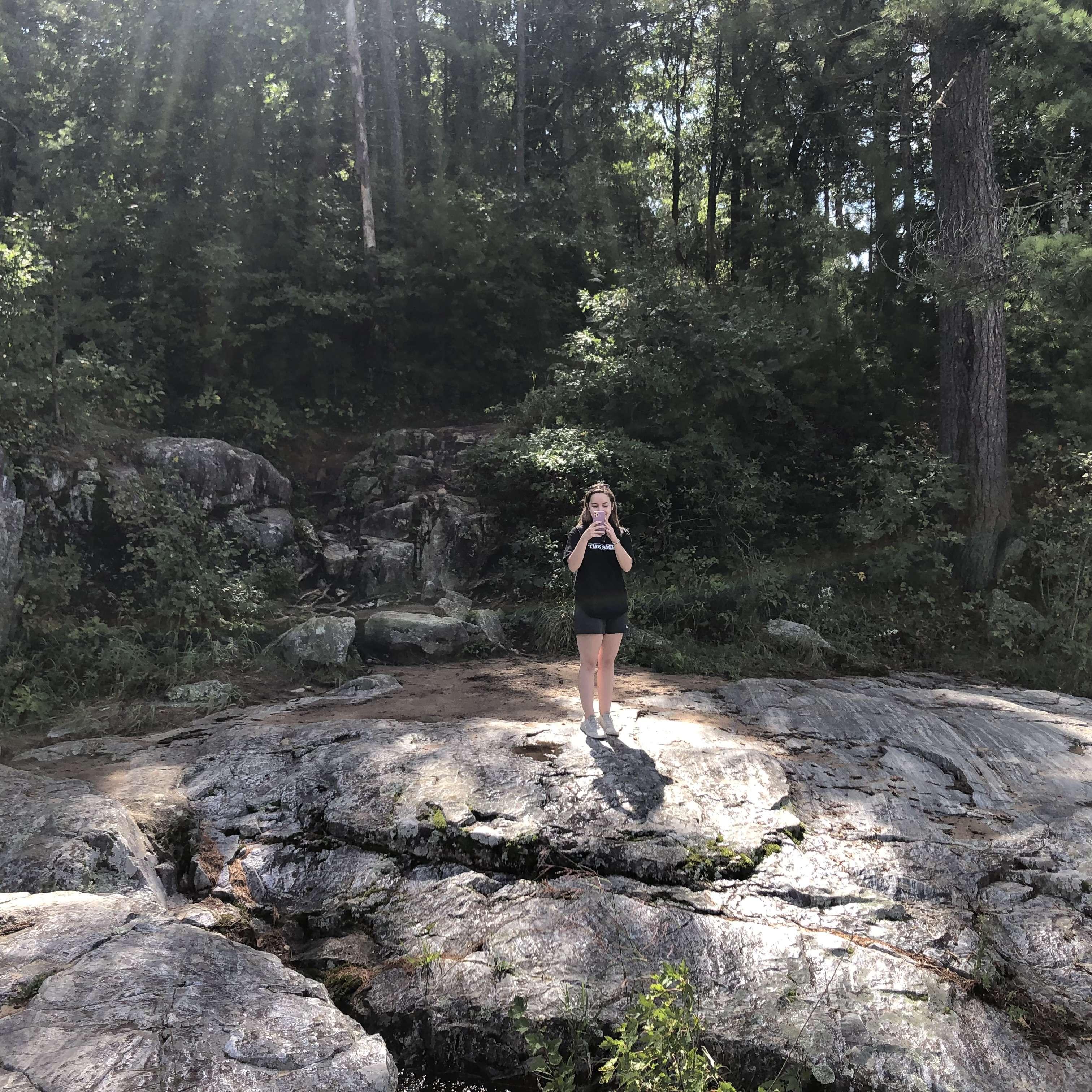 A photo of Abby taking a photo of Spencer taking a photo of Abby