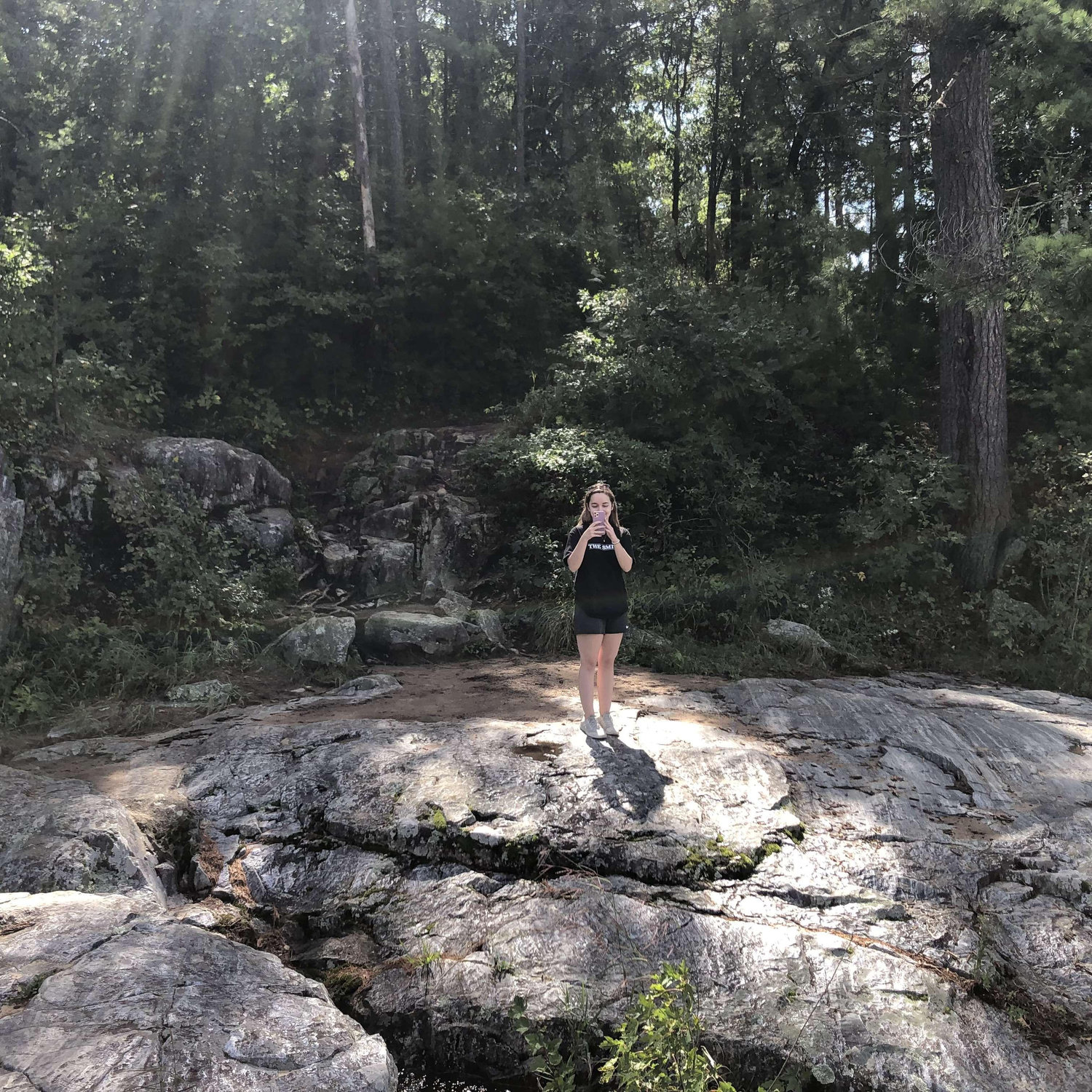 A photo of Abby taking a photo of Spencer taking a photo of Abby