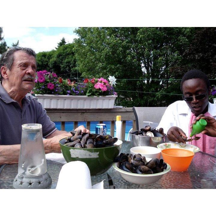 Katie's grandad John and Zacharie eating fresh mussels in New Brunswick