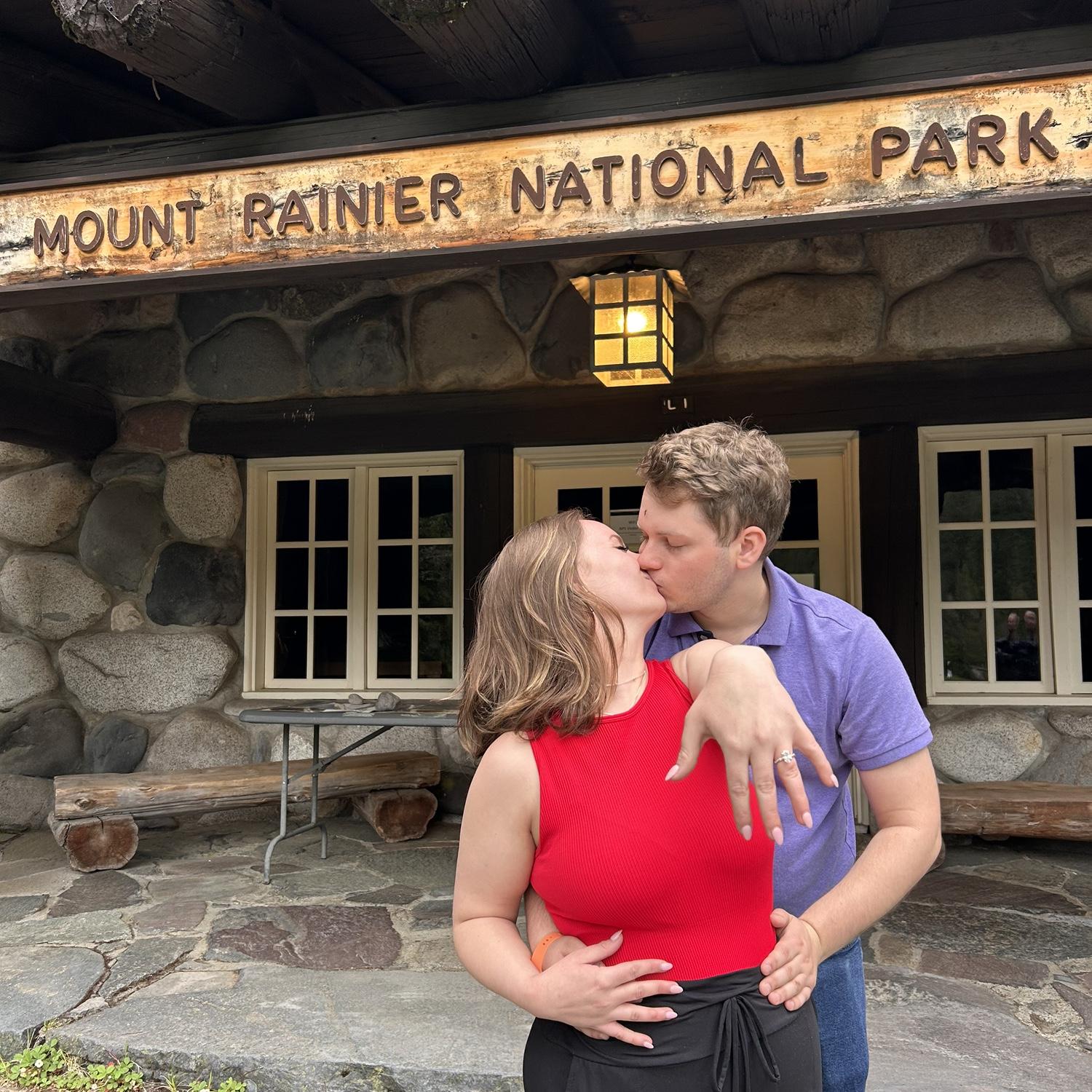 At the front entrance gate of Mount Rainier.
We hiked back down the mountain after the proposal and took this picture.