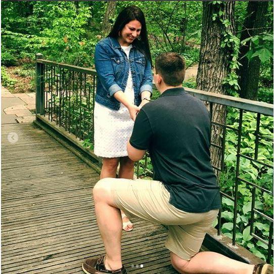 Proposal at Powell Gardens on a wooden bridge over a little brook.