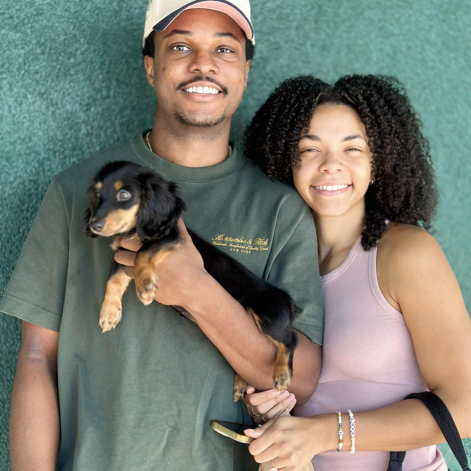 Ryan and Charlye with their dog Stitch when she was four months old