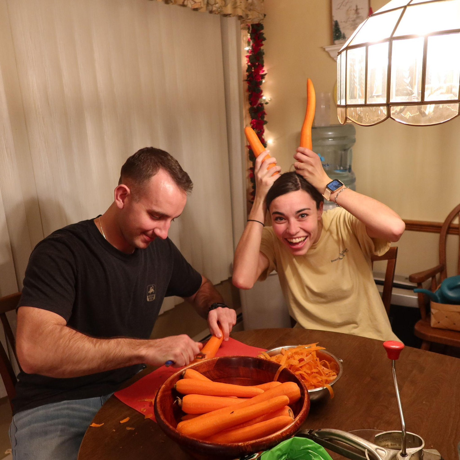 Chris is will never be bored with Angie around, even if they're peeling carrots :)