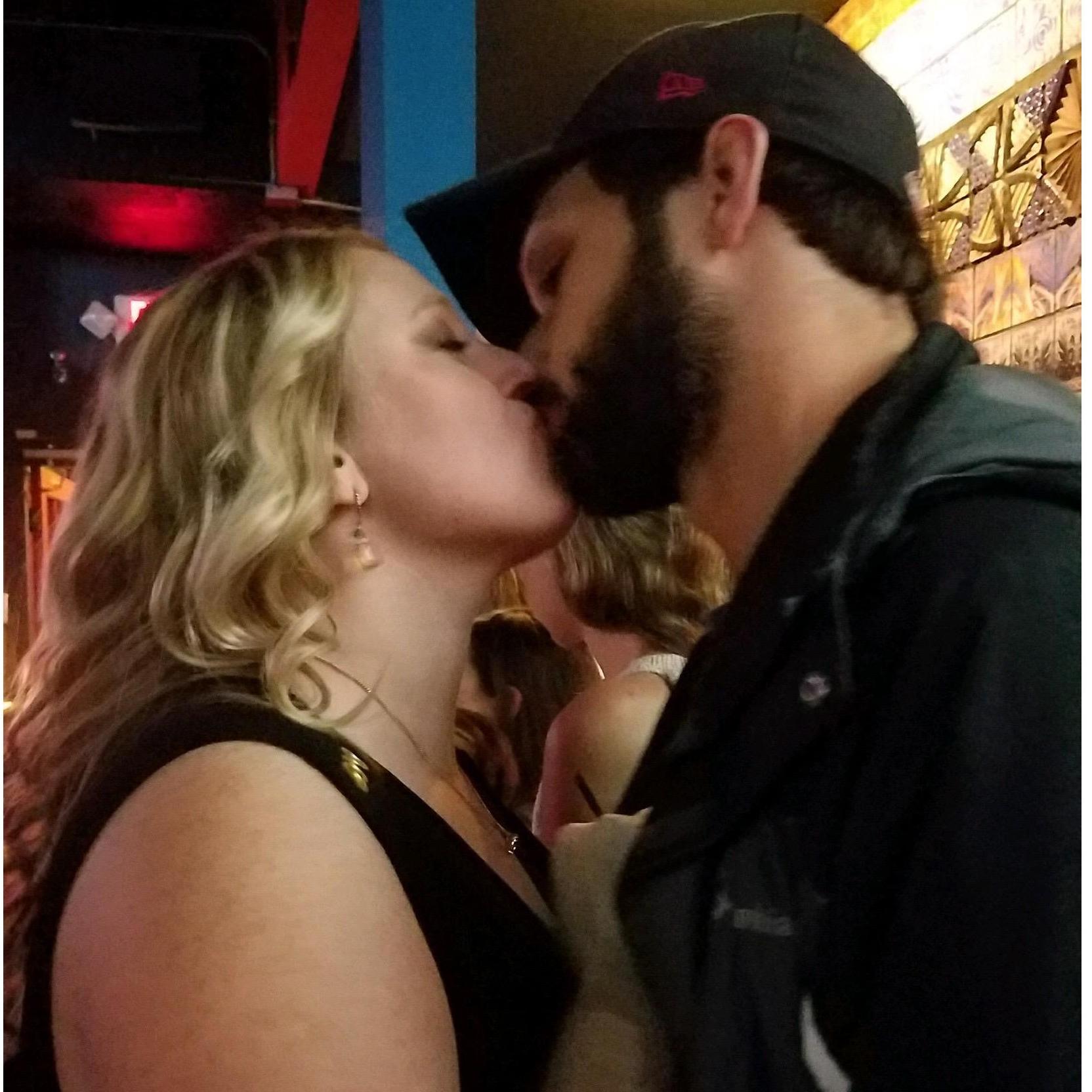 One of the first pictures of us that a friend snapped when we weren't paying attention to anyone but each other.  This was taken in the bar where we met!