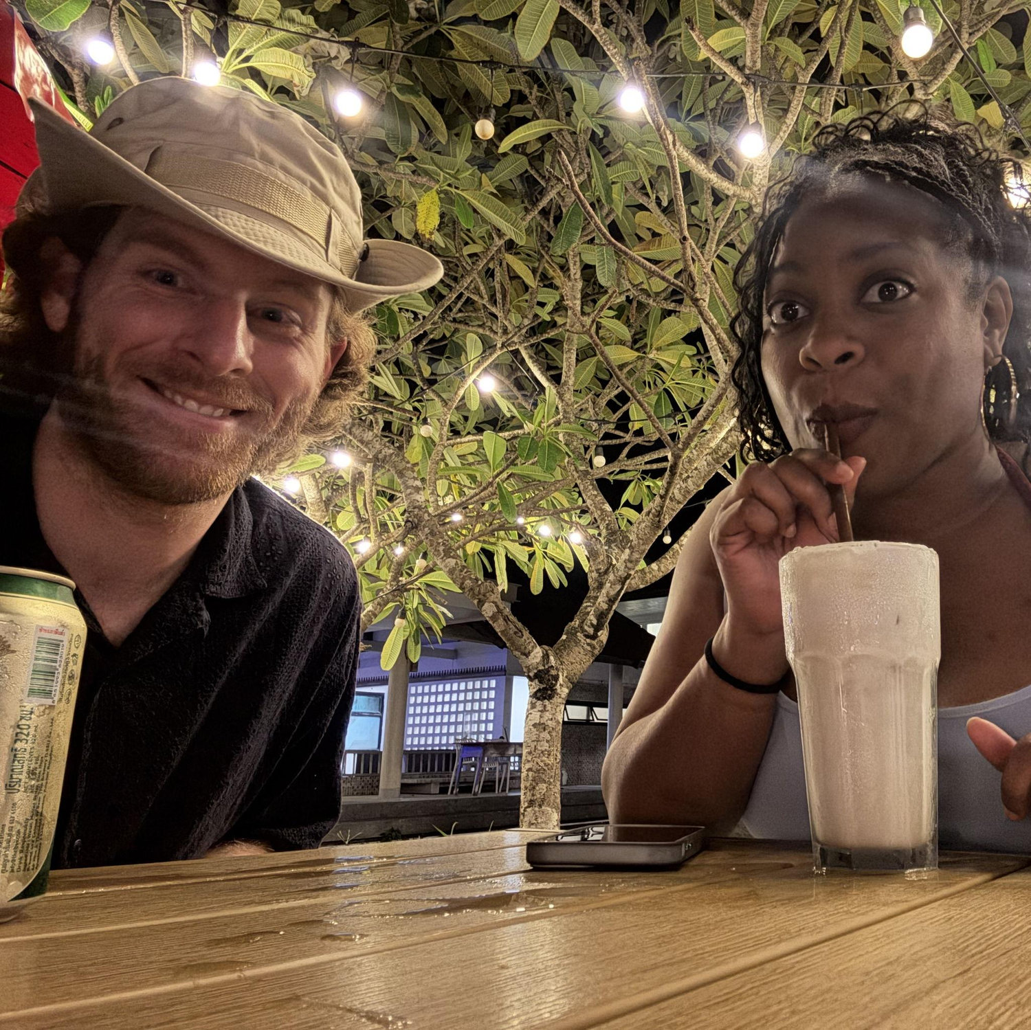 Taking a sip before dinner on the island of Koh Lanta, Thailand on a hot night.