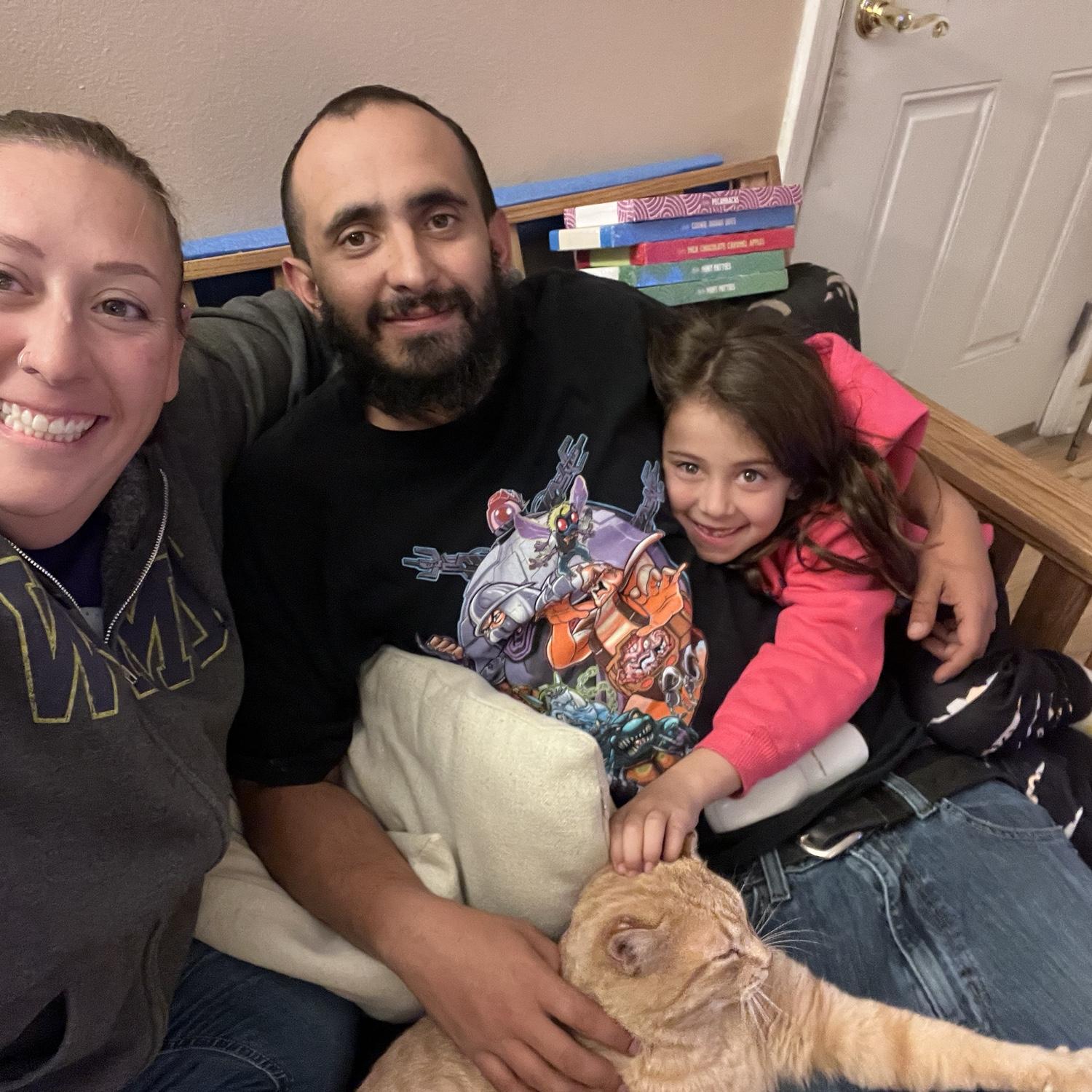The whole family likes to cuddle. Yes, that includes Squanchy the cat.