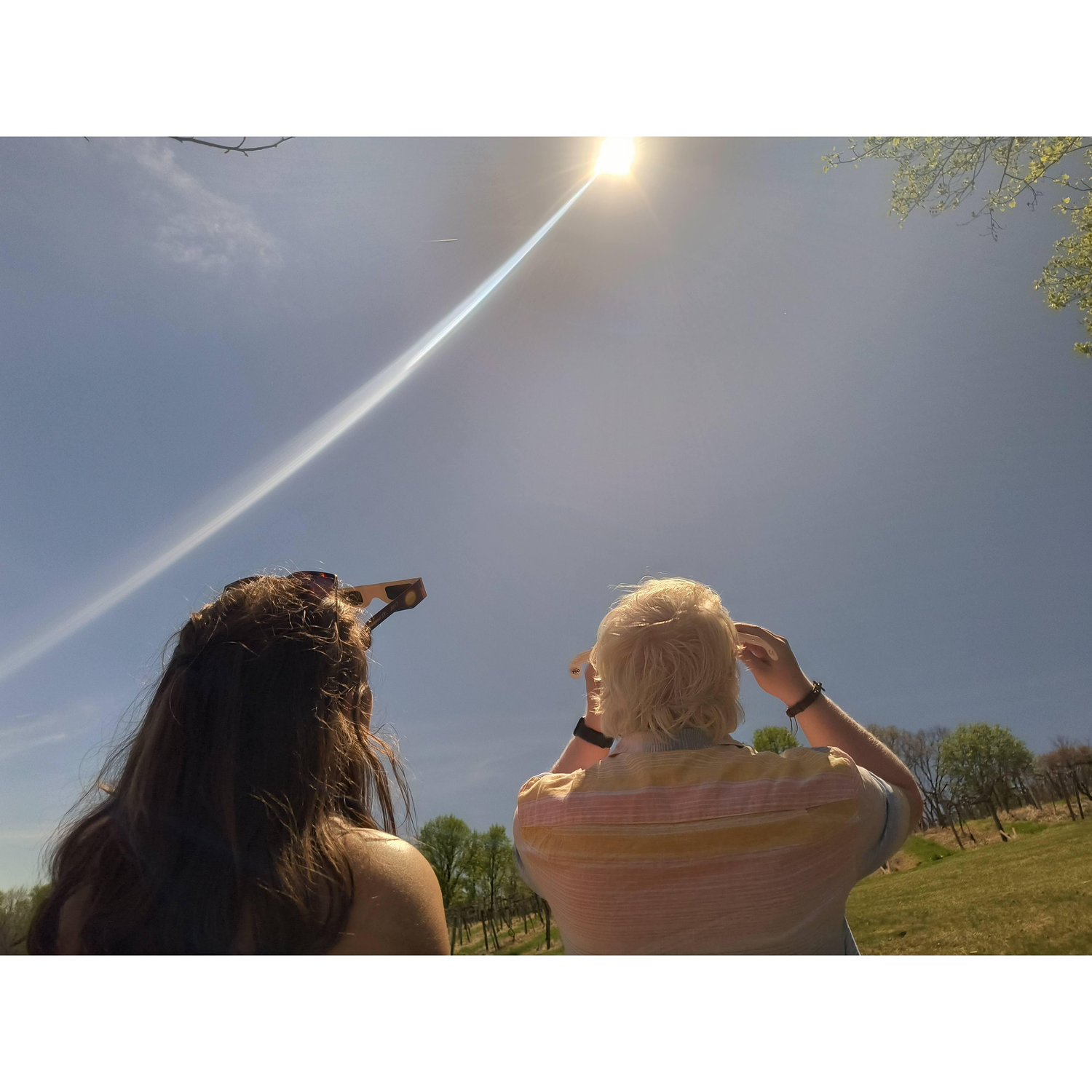 Us watching the solar eclipse on April 8th, 2024. JT would propose 4 minutes later!