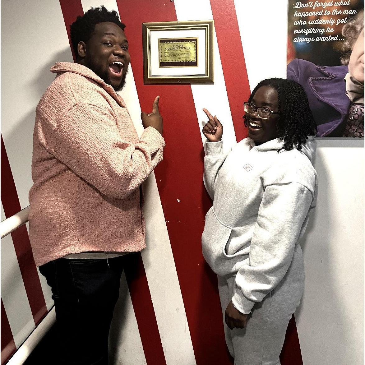 Us next to a *real* Willy Wonka Golden Ticket!