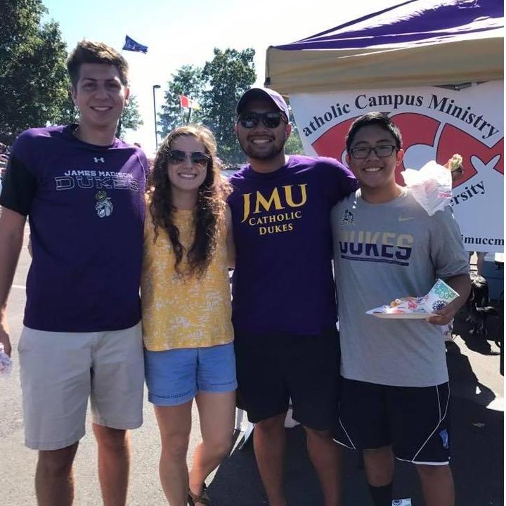 Madison and AJ tailgating with the Michaels on family weekend of senior year.