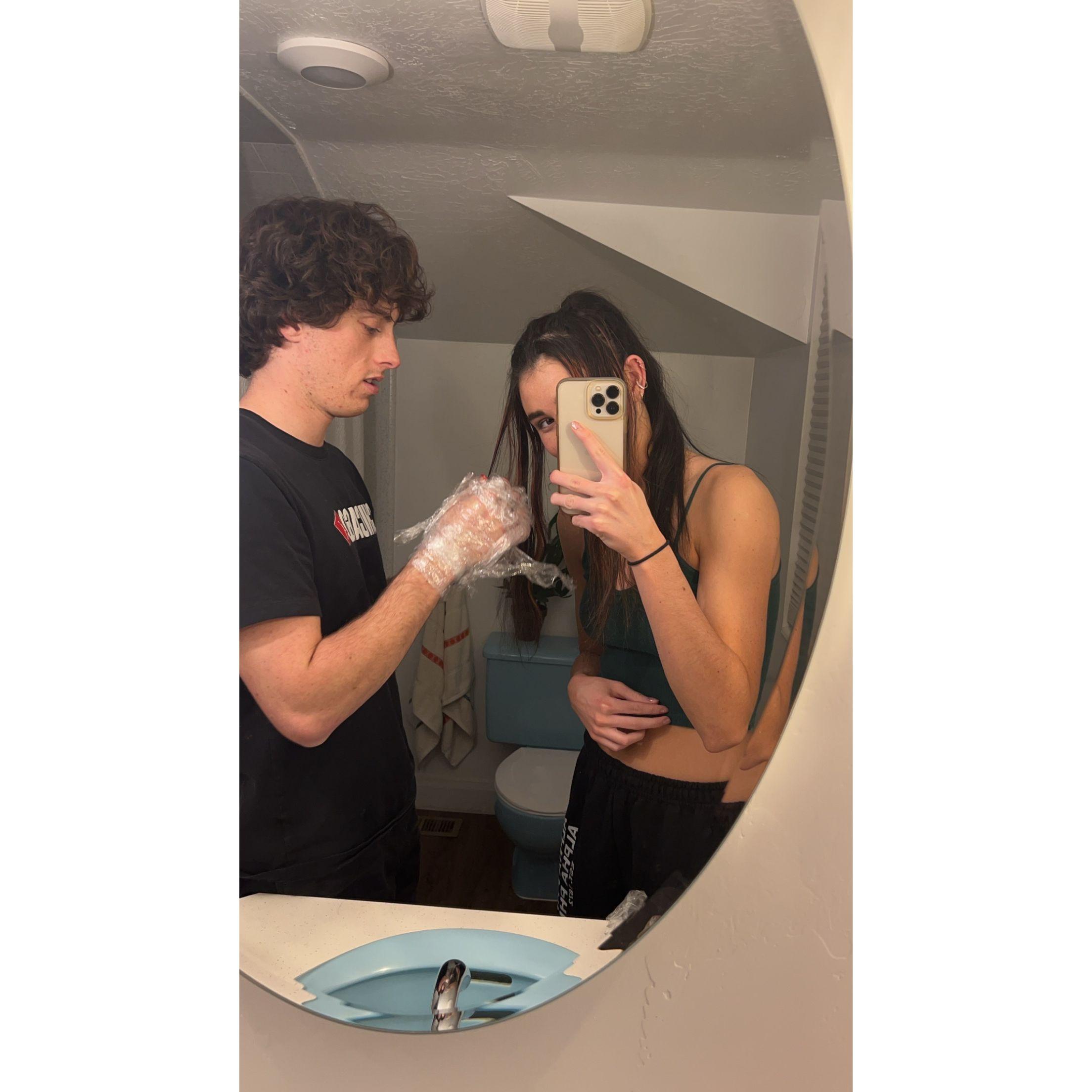 Bryant helping dye Jaidi's hair... We ran out of gloves and had to improvise.