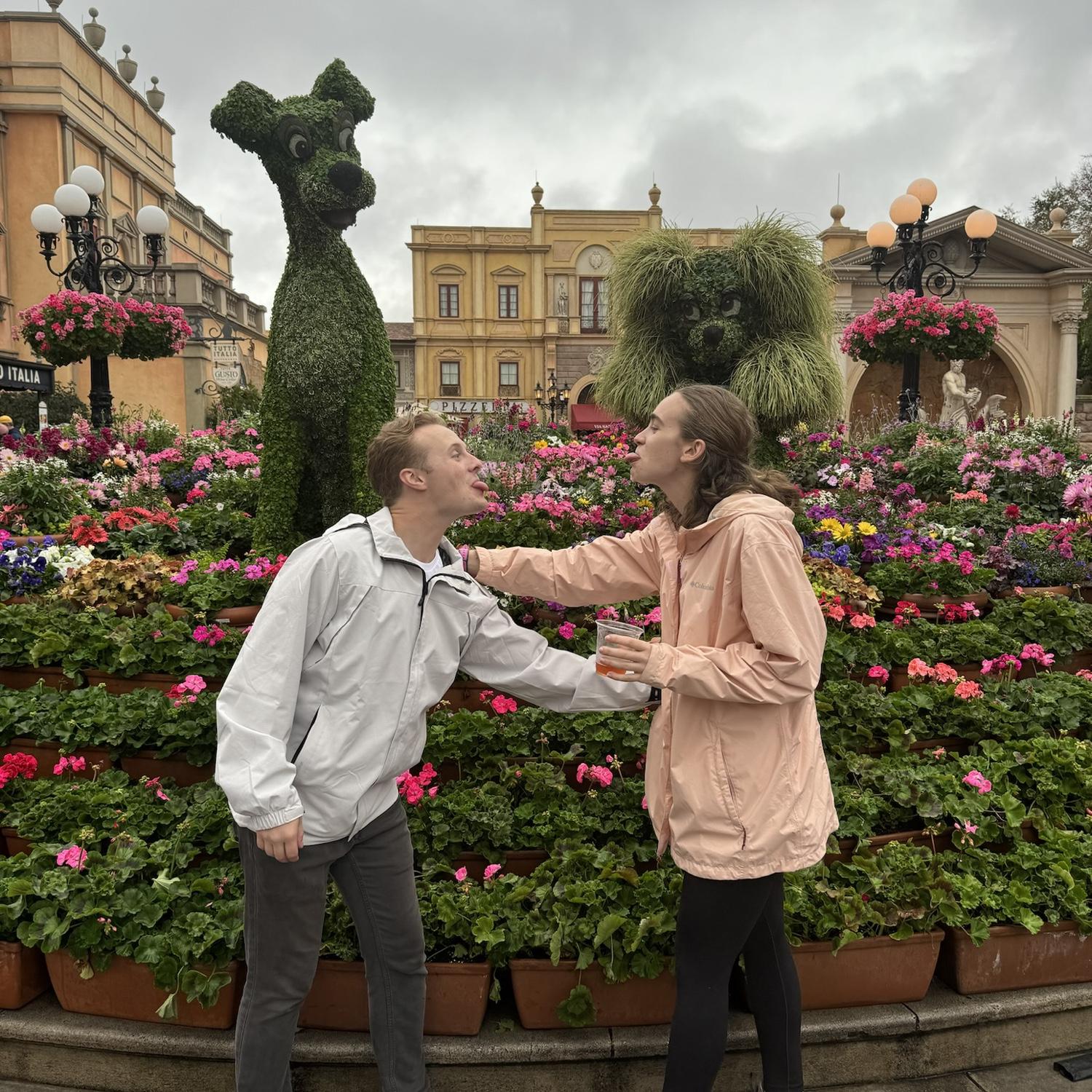 Drinking around the world at Epcot...This photo was in "Italy". Sean was trying to replicate the Spaghetti scene from Lady and the Tramp...it's unclear how this pose is that.