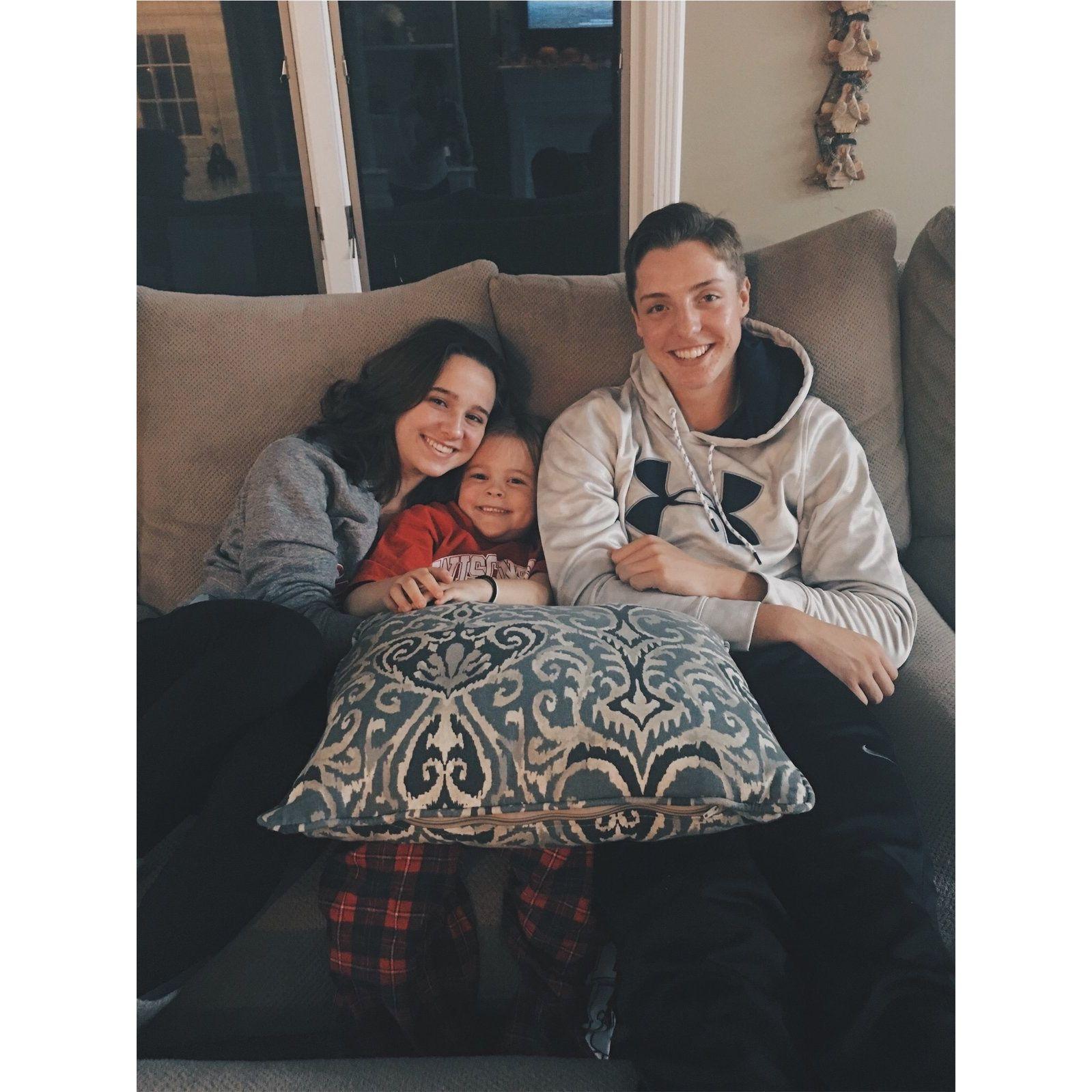 Cade, Munch and I watching a Badger Football game together. Lauren was only 7 here!