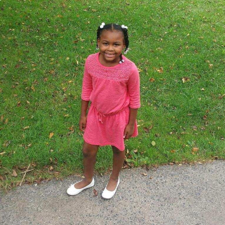 This is our beautiful grand-cousin Zuri. She's a little younger in this pic and will be our second flower girl. She lights up a room with her dimples.