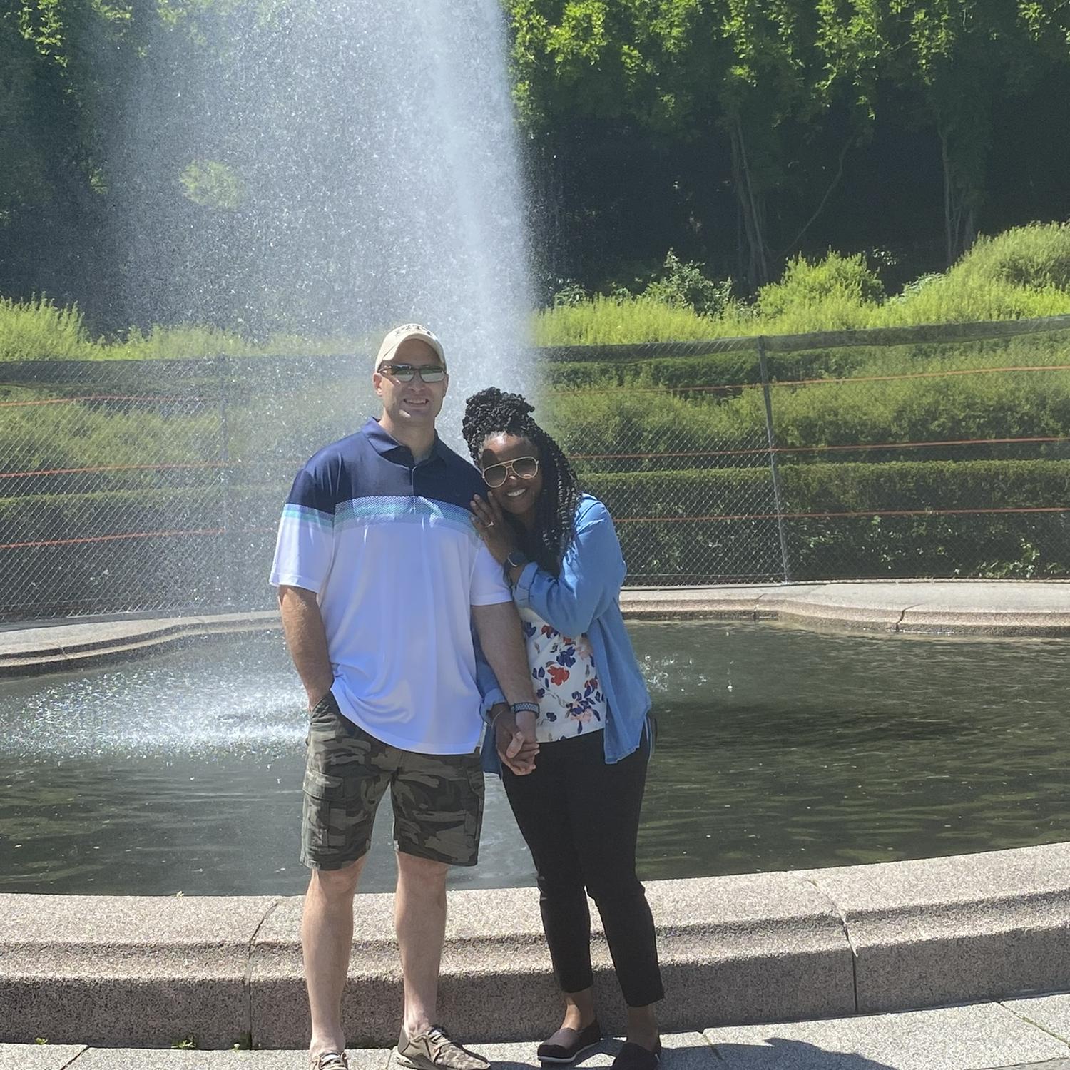 Newly engaged at the fountain in Central Park Conservatory Gardens, May 26th, 2023