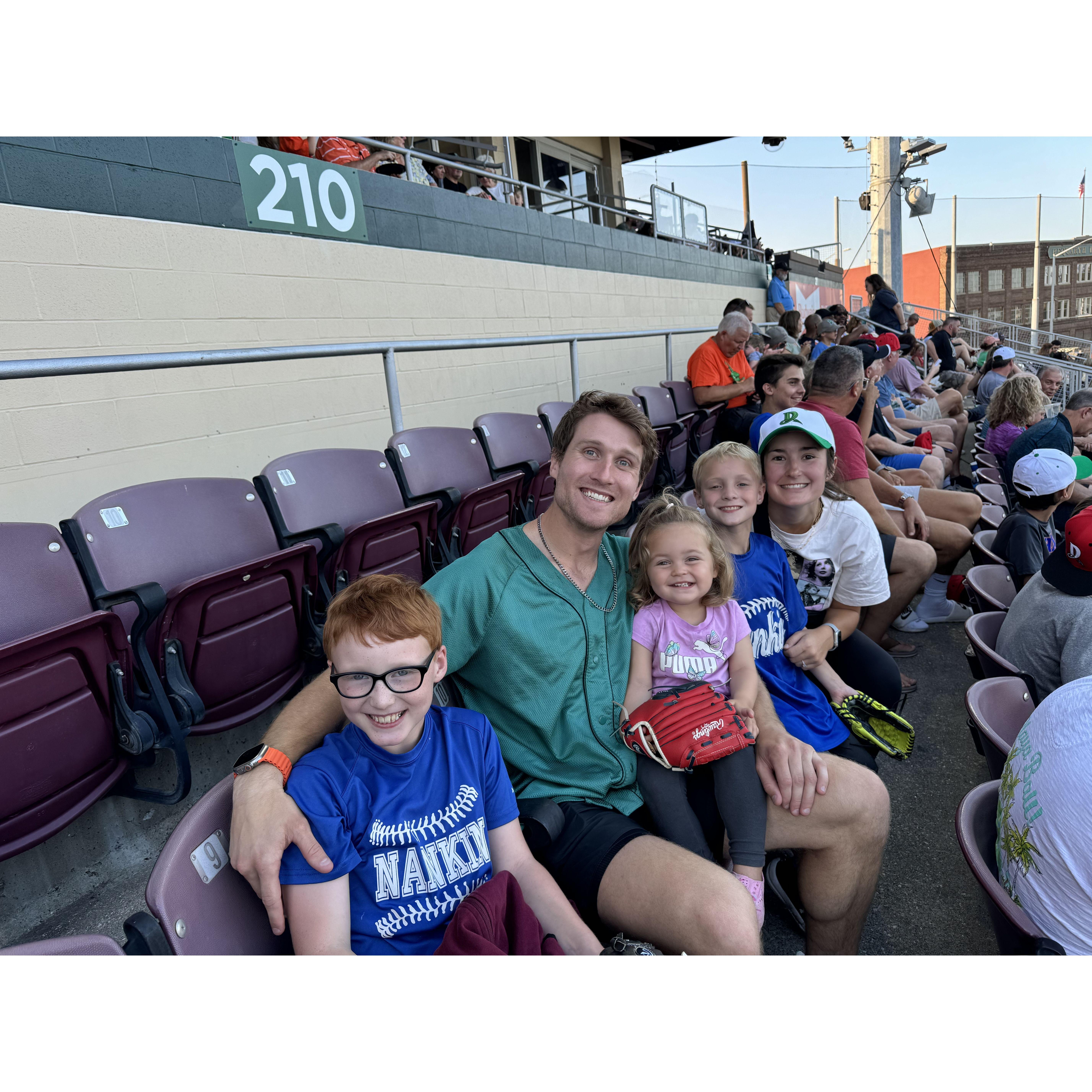 Dayton Dragons baseball game with flower girl Penelope and sons of Emily, Zayne and Ian.