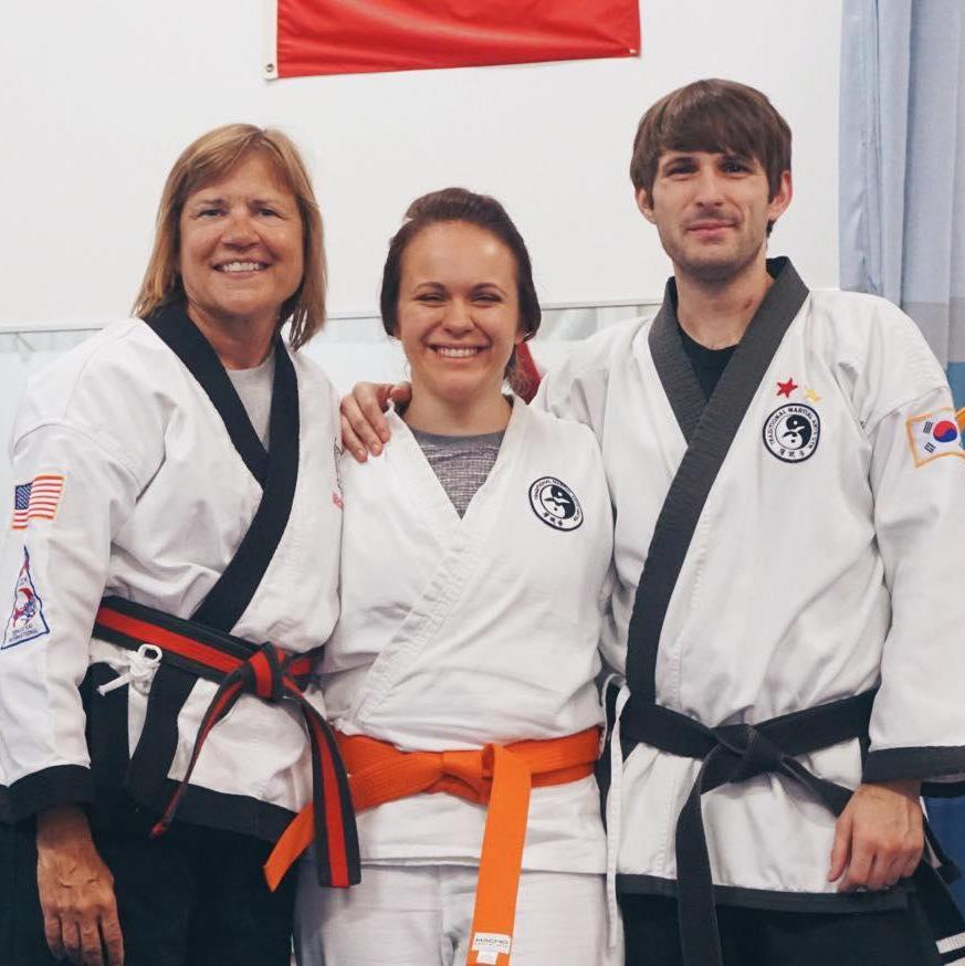Taken right after Sara earned her orange belt at their martial arts school.