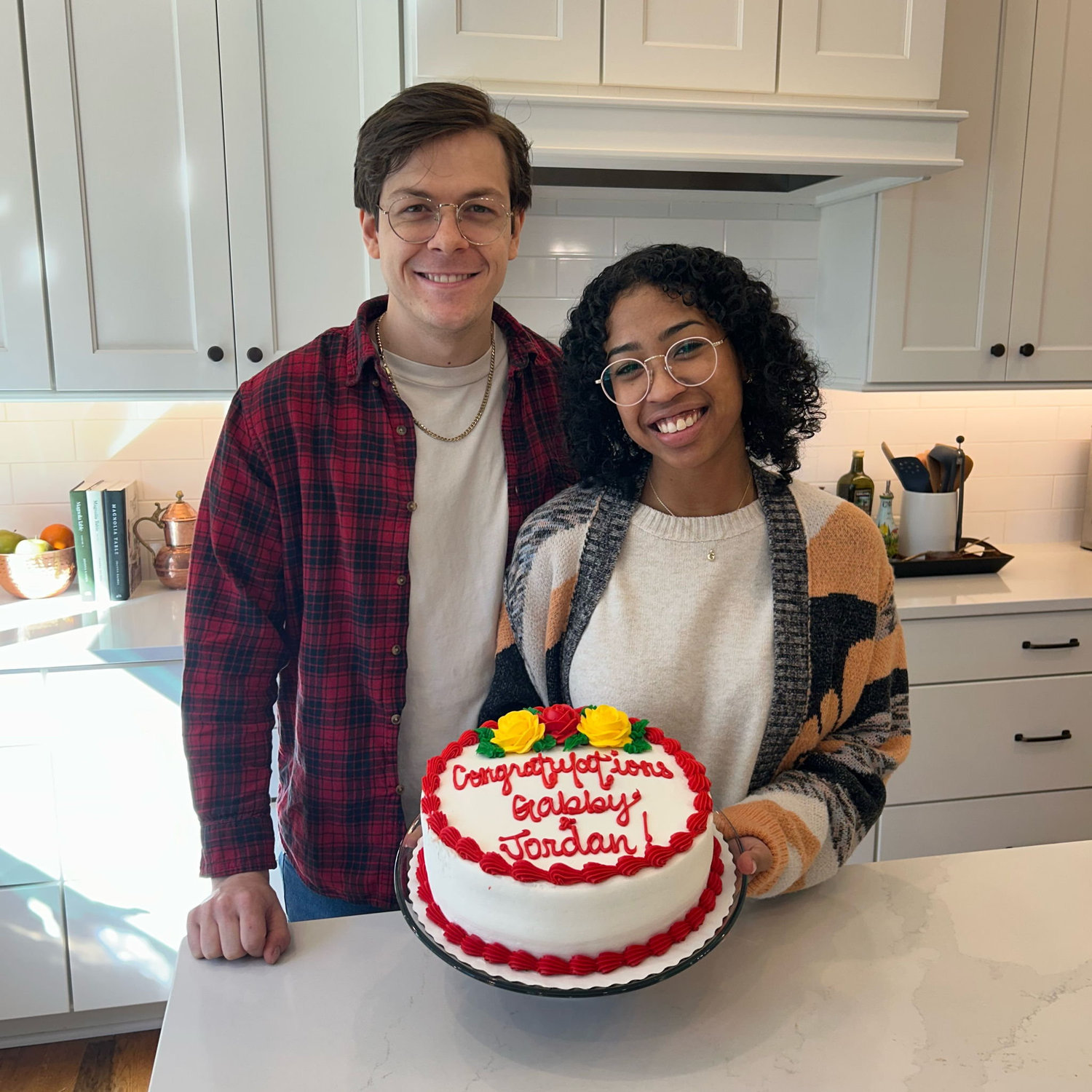 Celebrating our engagement with a cake from Aunt Amy and Uncle Andy!