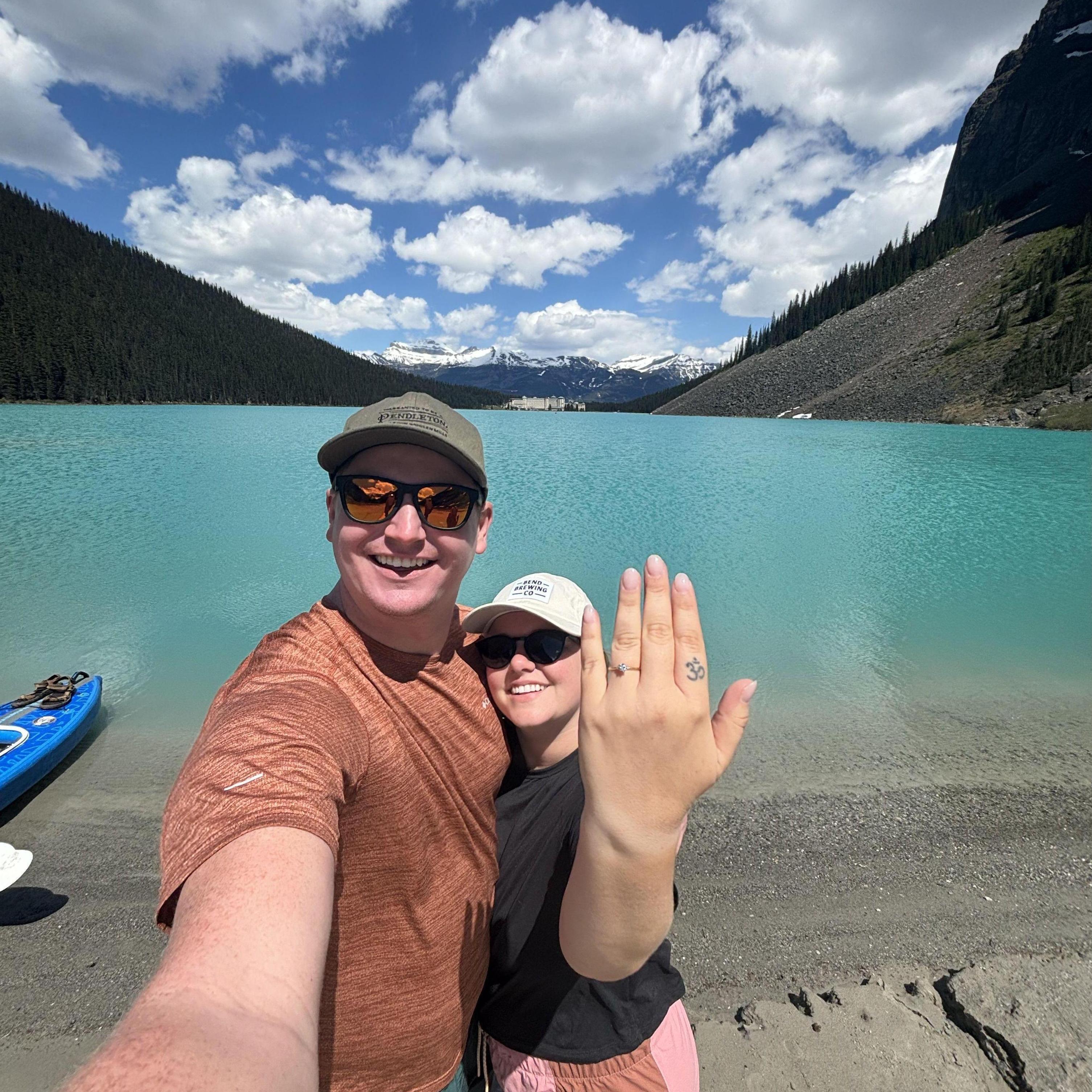 Celebrating our engagement on the shores of Lake Louise! Peep the inflatable kayak that Chris managed to get down on one knee on!