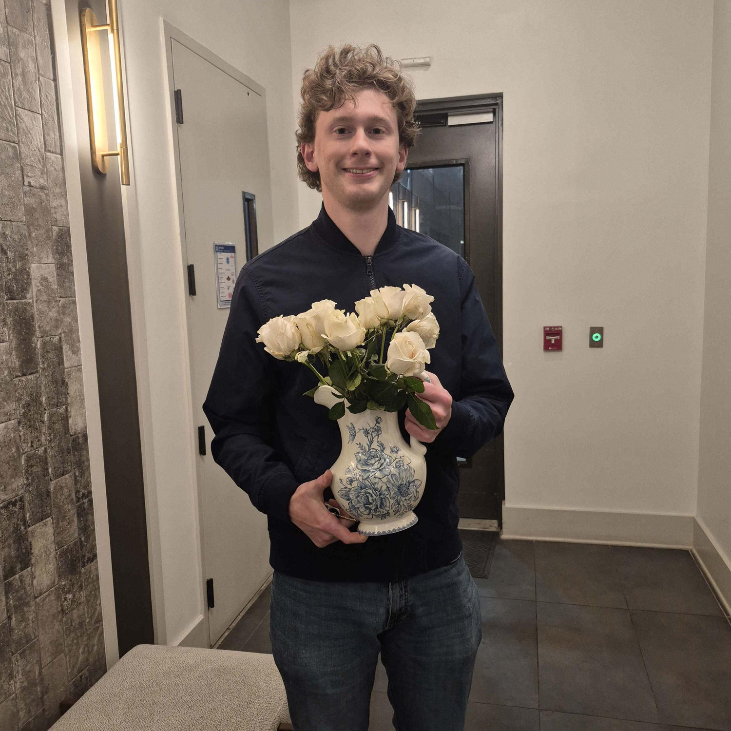 Josiah and the flowers he got me for graduation.
