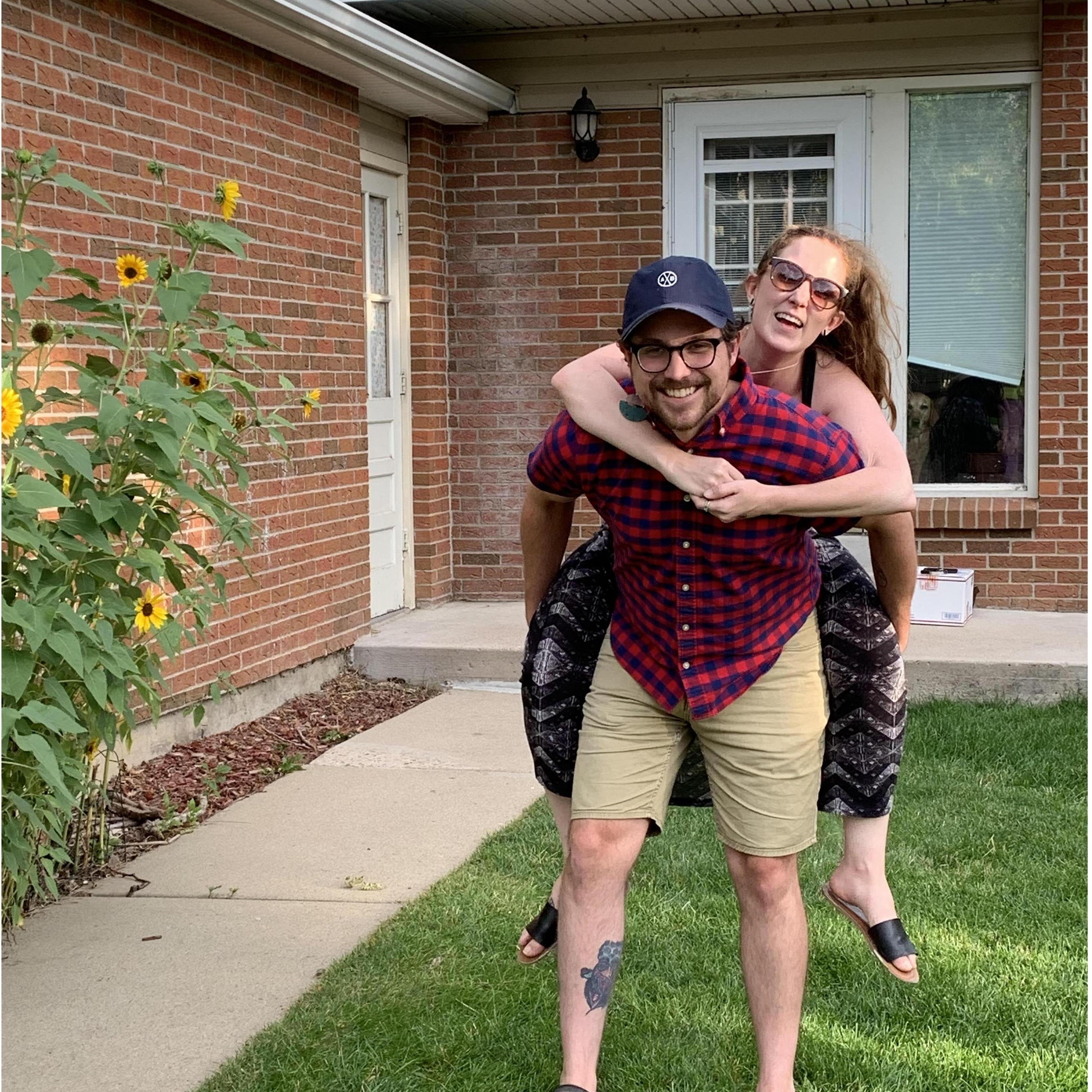 Celebrating becoming first-time homeowners! Don't miss Bailey's ecstatic face in the window.