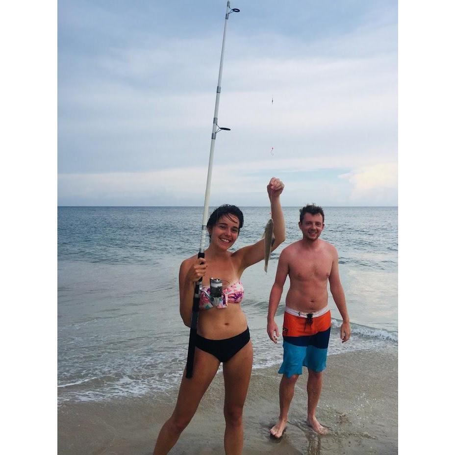 Outer Banks, NC family trip.. Ryan had his pole in the water for an hour and hadn't caught anything.. Mo comes by and gives it a try. Within minutes we have a fish!