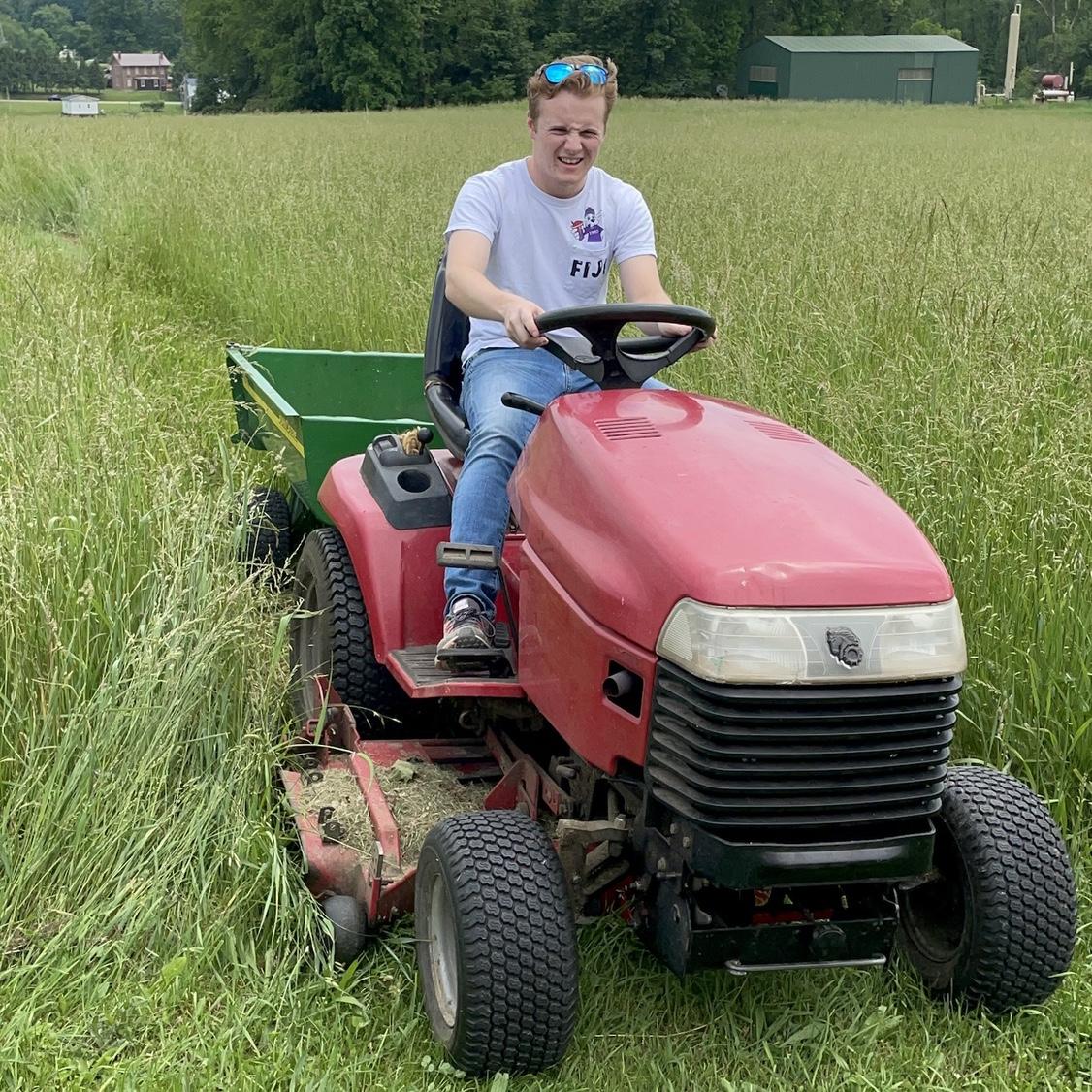 It's not possible to visit Kristen's Grandma Knepshield and NOT do some sort of work! Sean had a good time driving the tractor.
