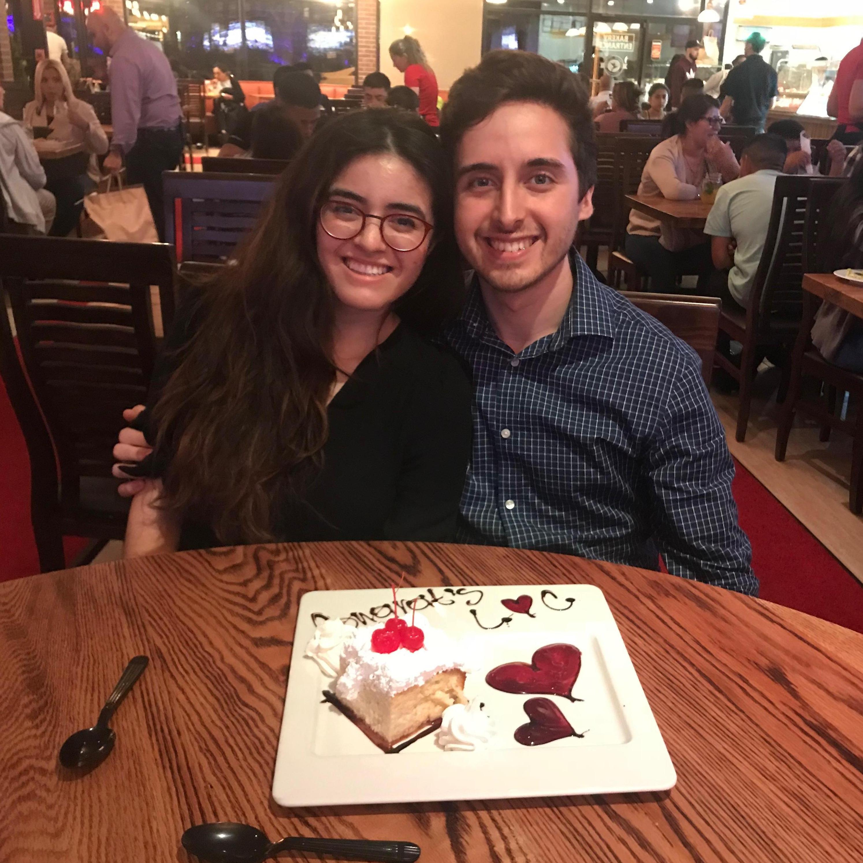 Celebrating our engagement with our family and some tres leches cake!