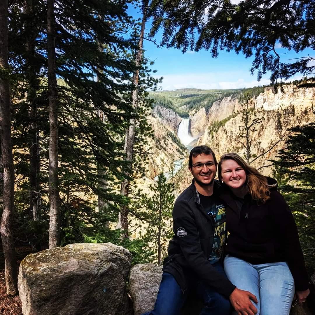 The couple posing in front of a monumental sight while visiting Brock's family.