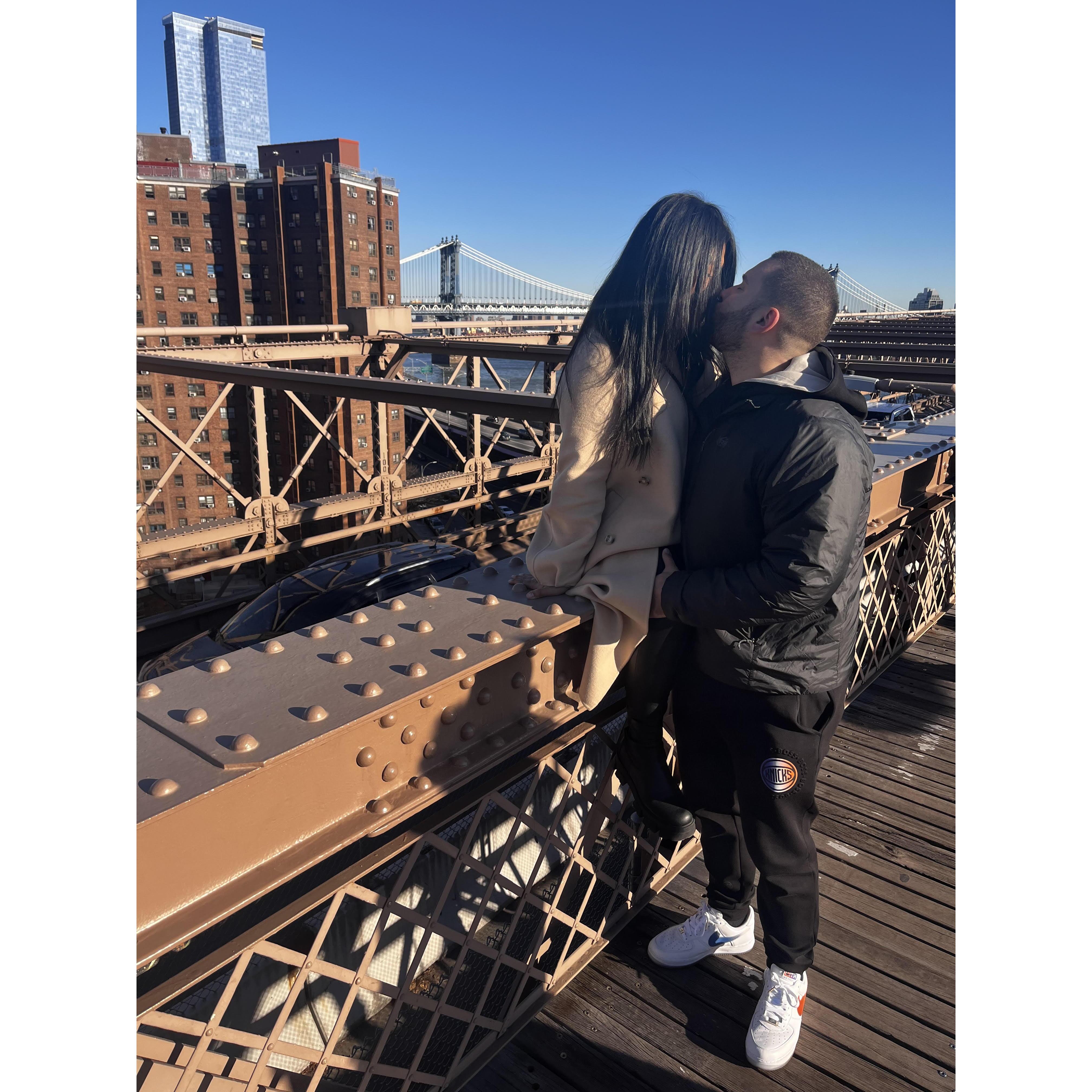 A kiss on the Brooklyn Bridge.