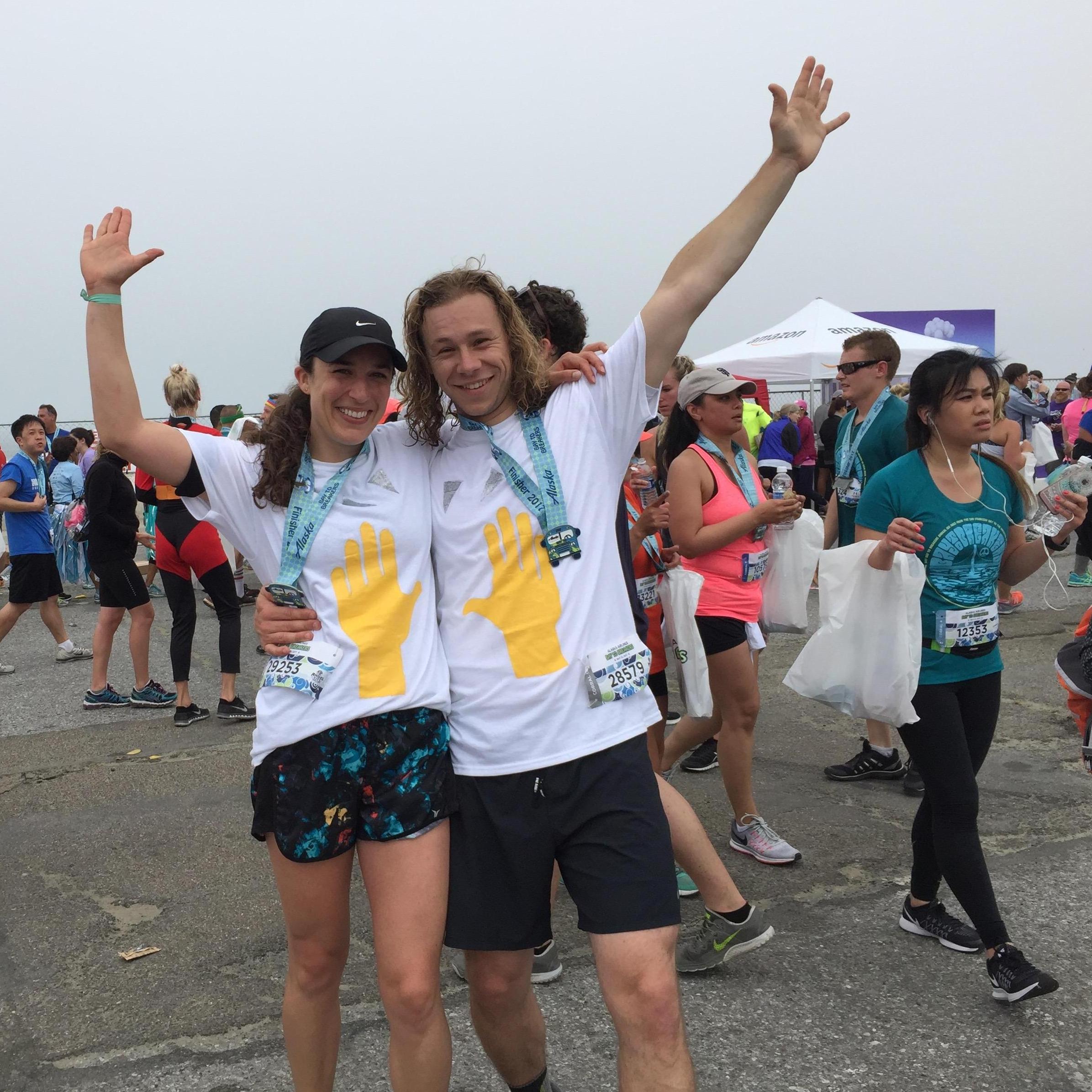 Finishing the Bay to Breakers 8 mile race with our custom made "hands raised emoji" t-shirts.