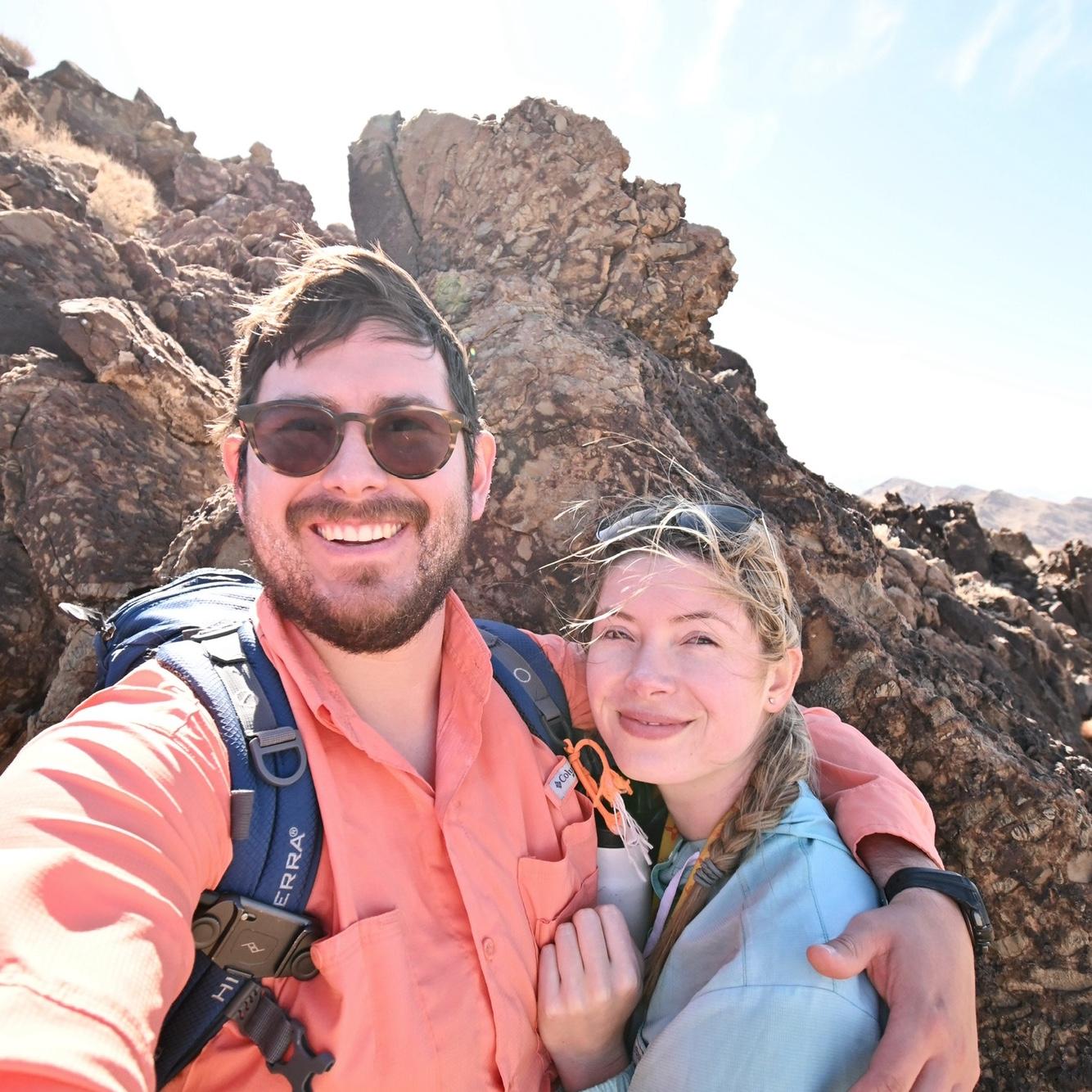 2021: Working in Death Valley for one of Sarah’s PhD projects. We’re smiling here in front of a ~600 million-year-old rock deposited by an ancient river, which we mapped over the Nopah Range.