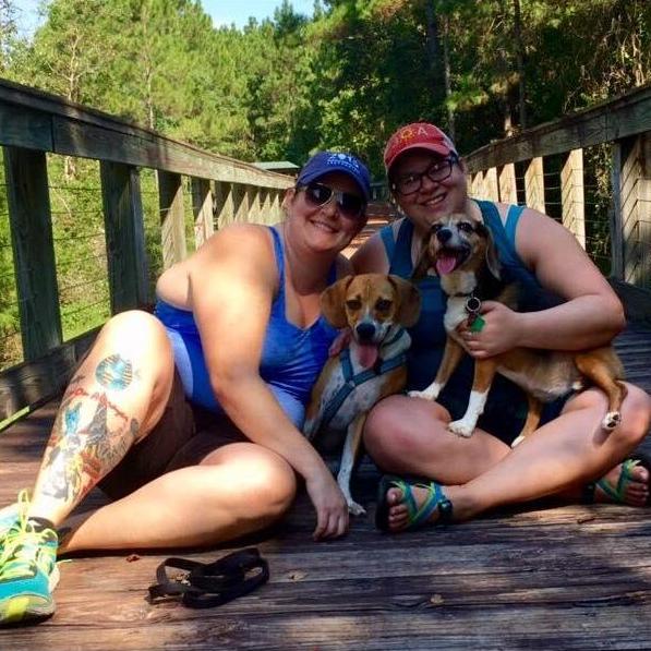 Family picture with our girls Lucy and Juno at our favorite walk spot, Bayou Marcus.