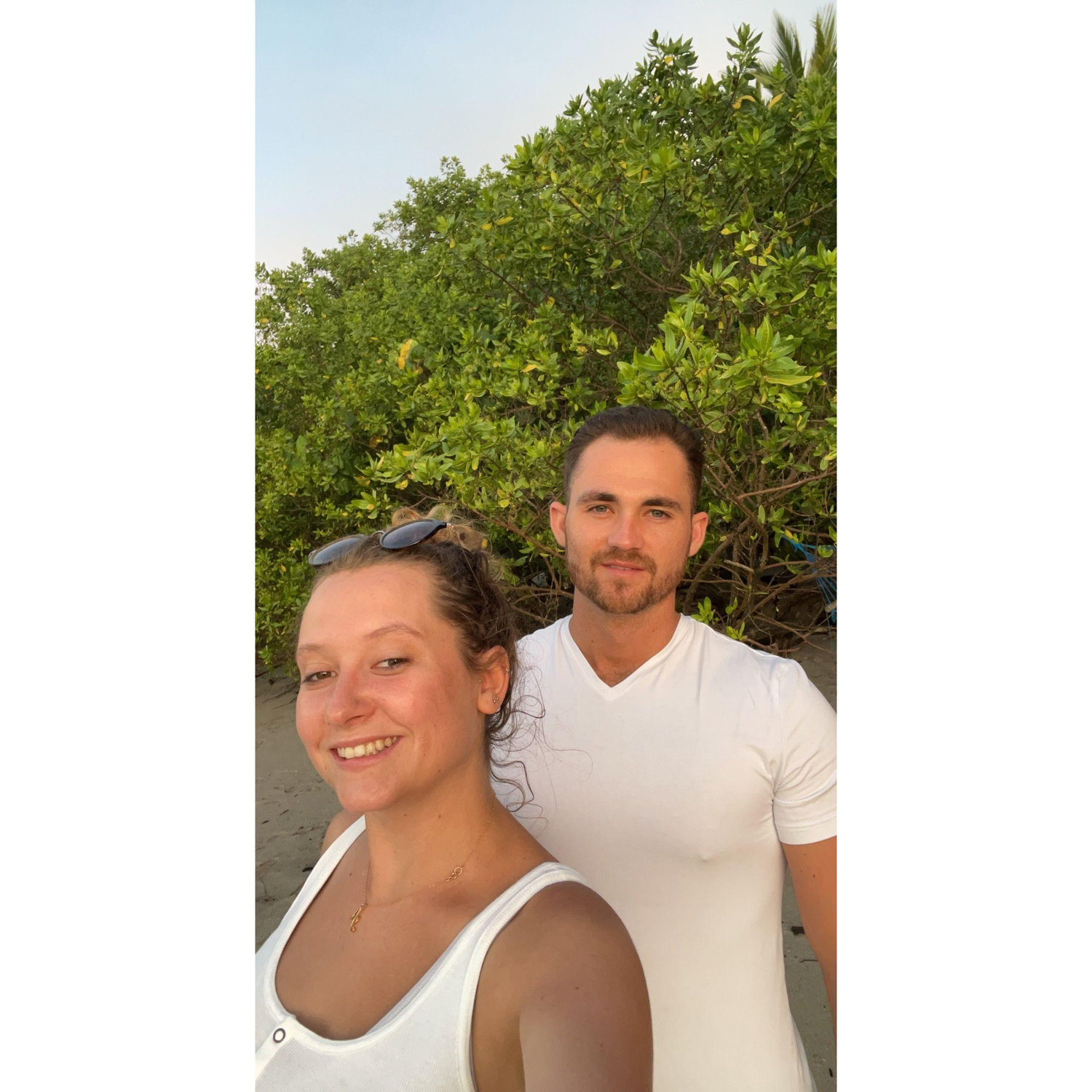 Super tan & enjoying a sunset on the beach in Costa Rica