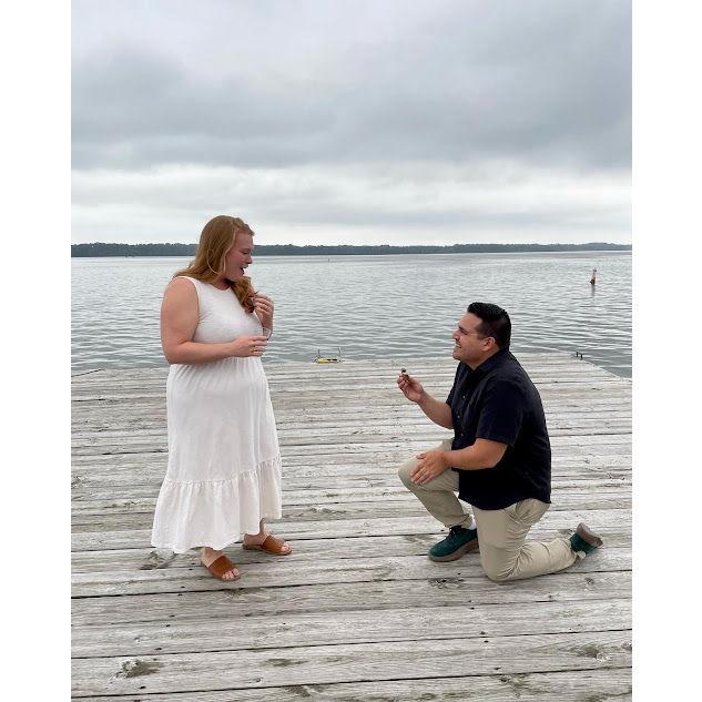 Ricky popping the question in front of Shannon's family at the Erie Yacht Club lighthouse.