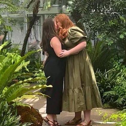 Rachel proposes on May 29, 2022 in the ferns room of the Botanical Gardens. Molly, of course, says yes!