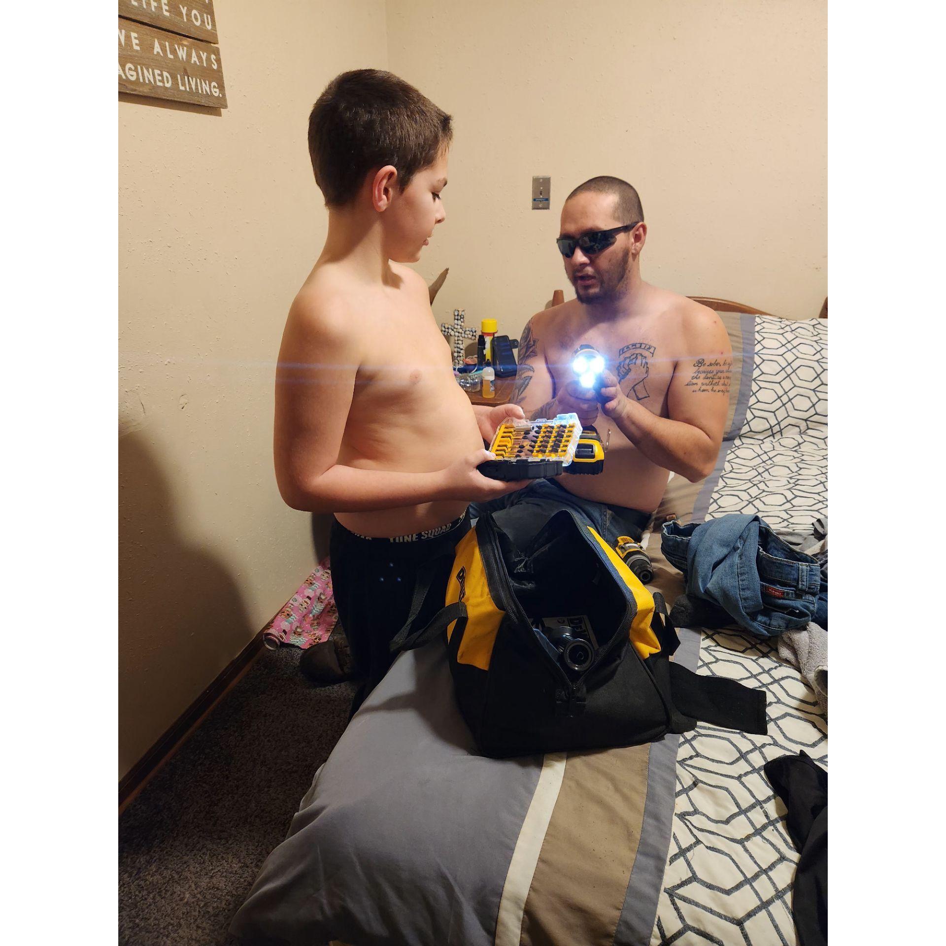 Teaching David how to use a drill