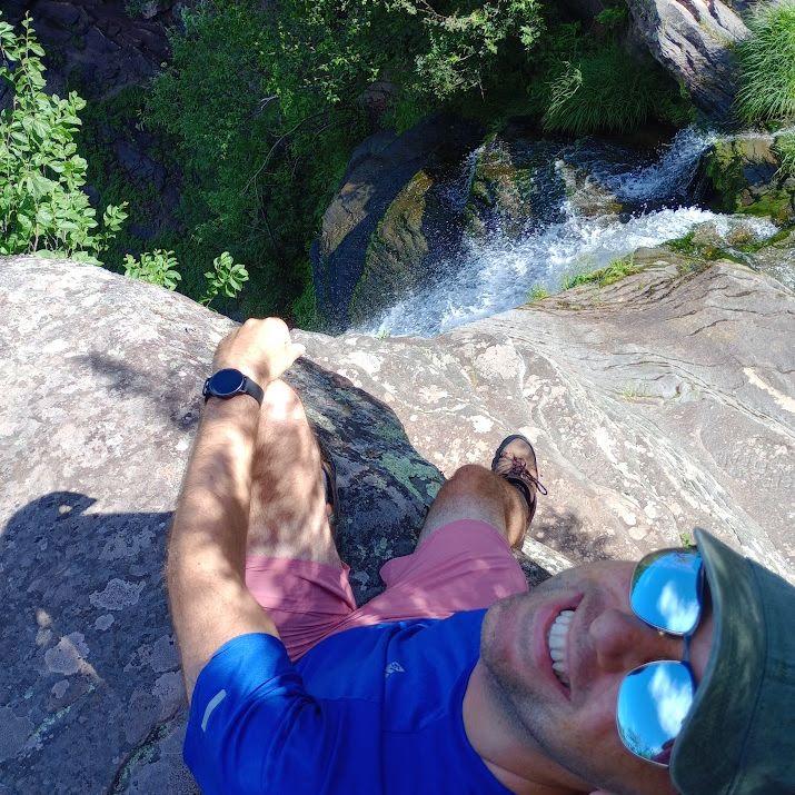 Michael appreciating the view on a hike (Kaaterskill Falls, NY - 2025)