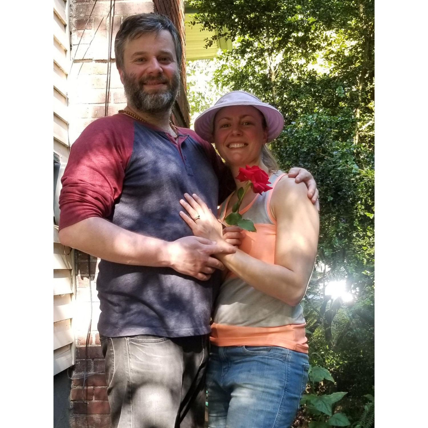 The proposal! Fred managed to surprise Jamie on a hot 90 degree day while she was gardening. He handed Jamie and red rose, said some real sweet stuff, got down on one knee and asked to marry her!