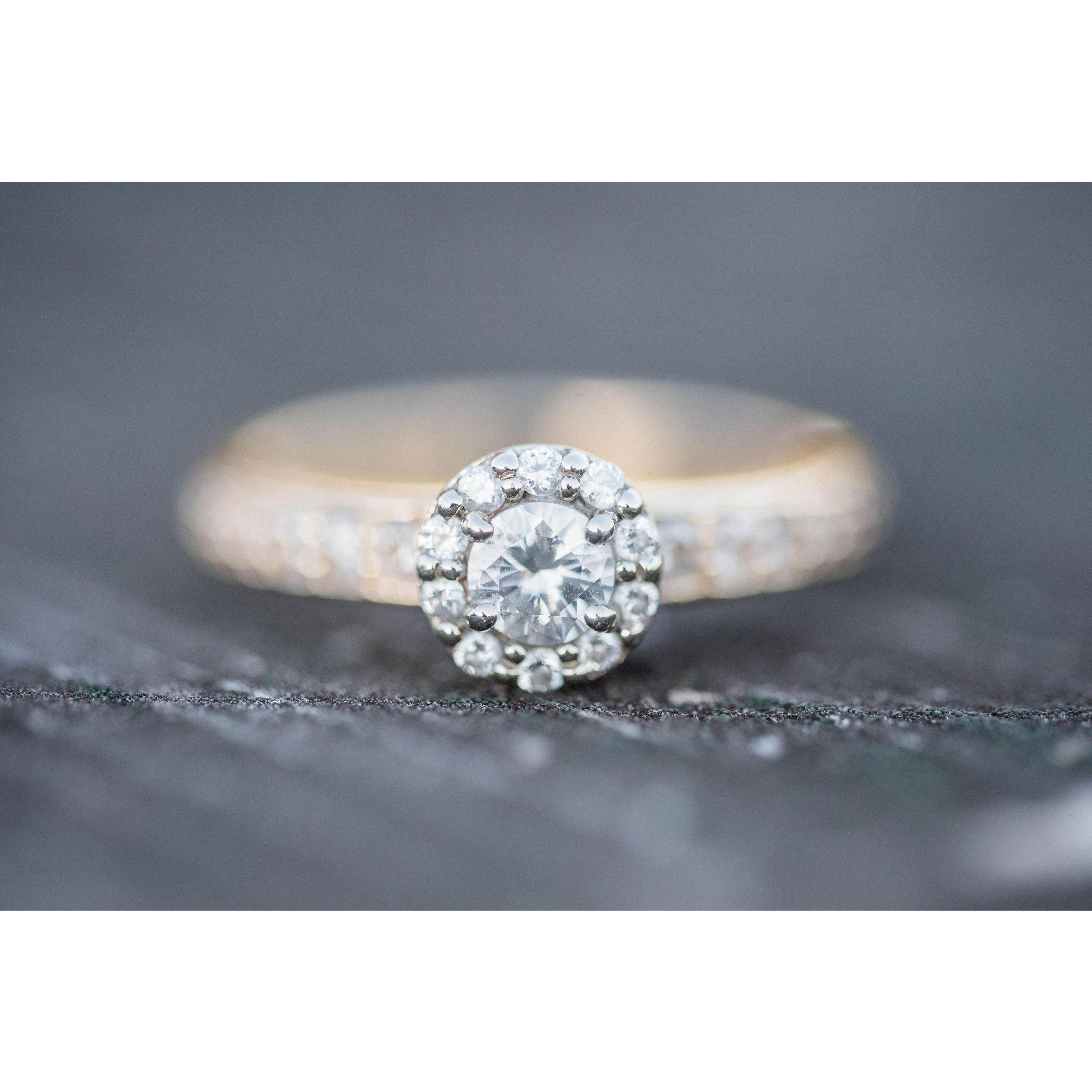 Bethany's engagement ring contains three maternal generations of diamonds - from Logan's mother, grandmother, and great-grandmother! Logan custom-designed the ring and named it "The Bethany Ring."