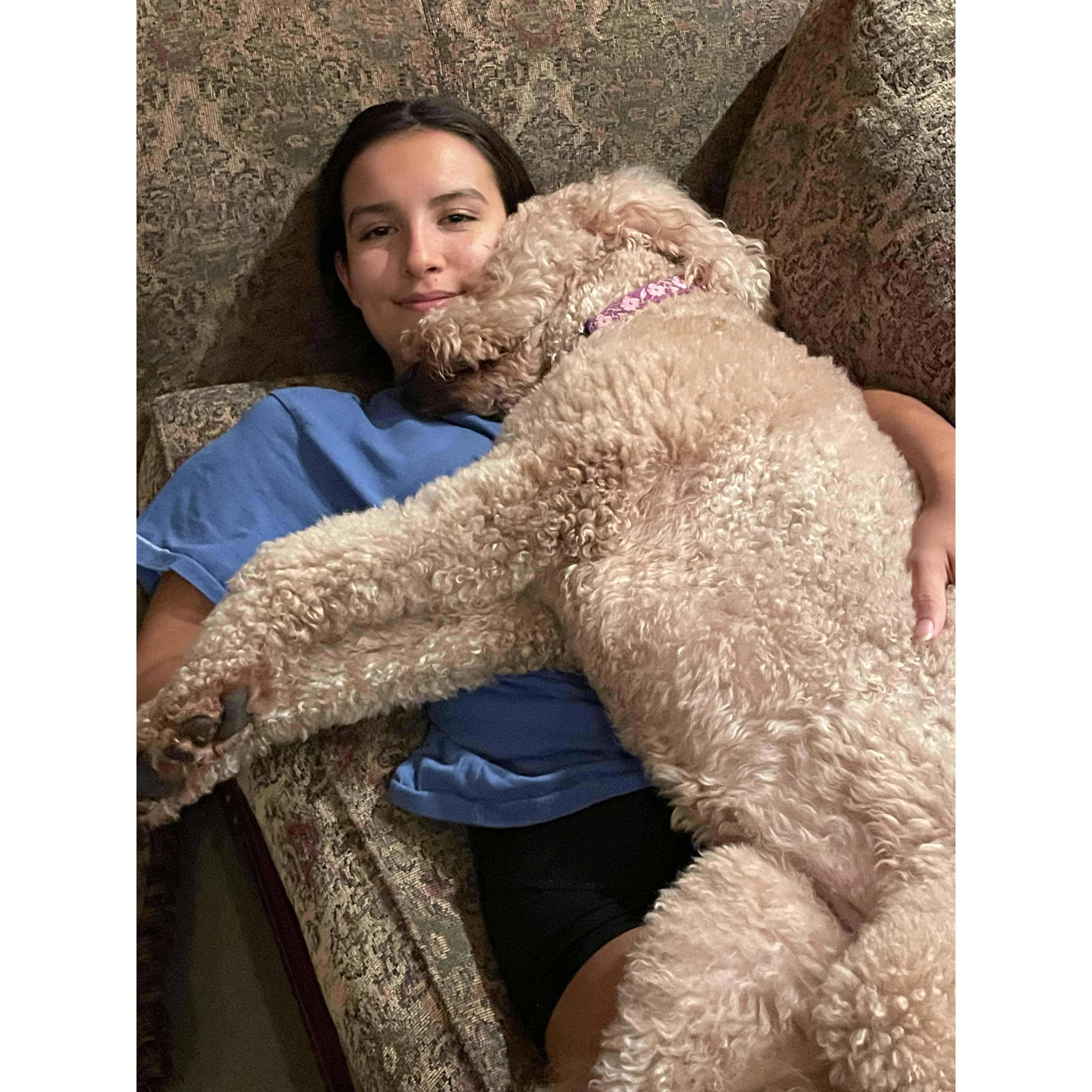 Sasha cuddling her dog daisy!