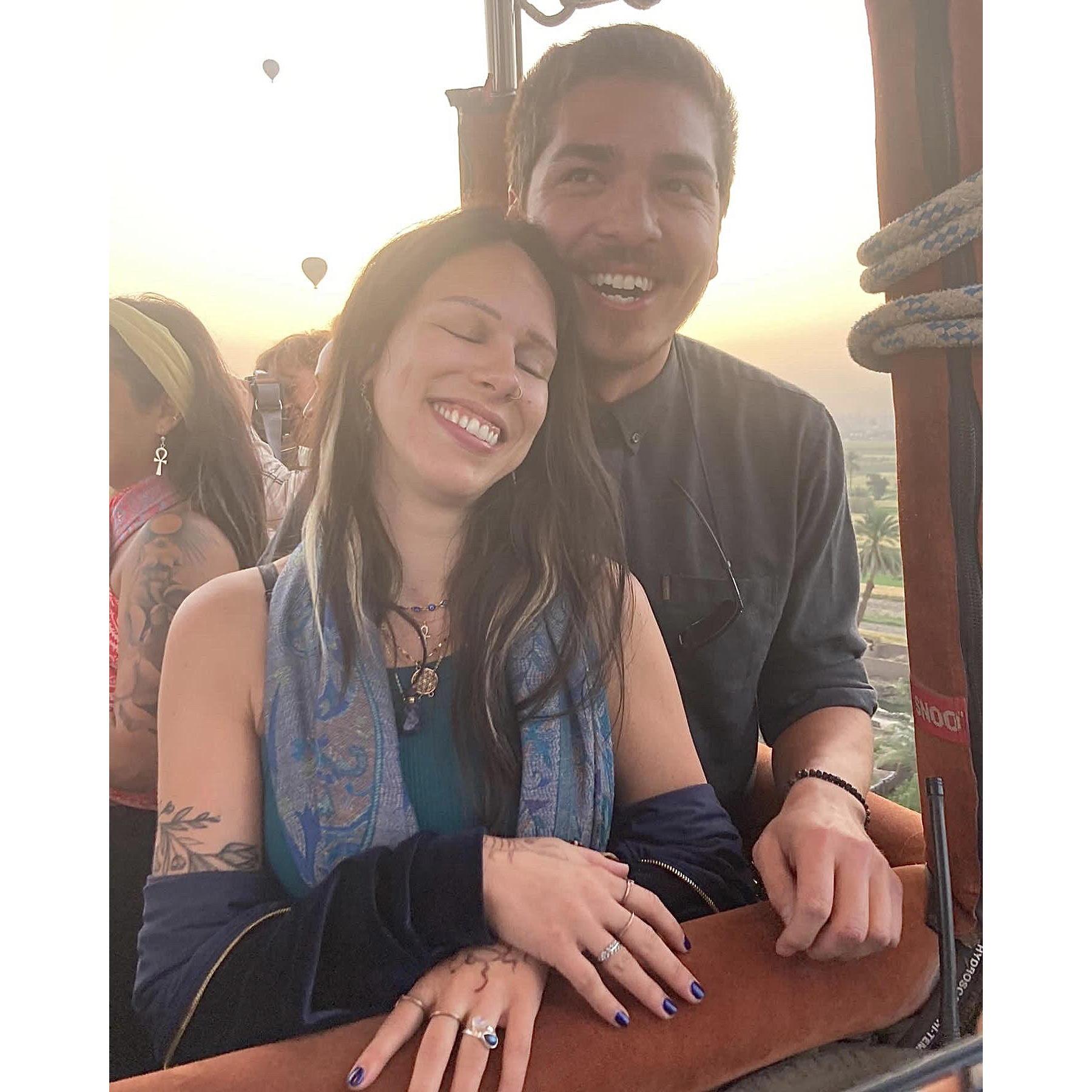 Joe proposed on a sunrise hot air balloon ride flying over the Valley of the Kings and Queens in Luxor, Egypt.