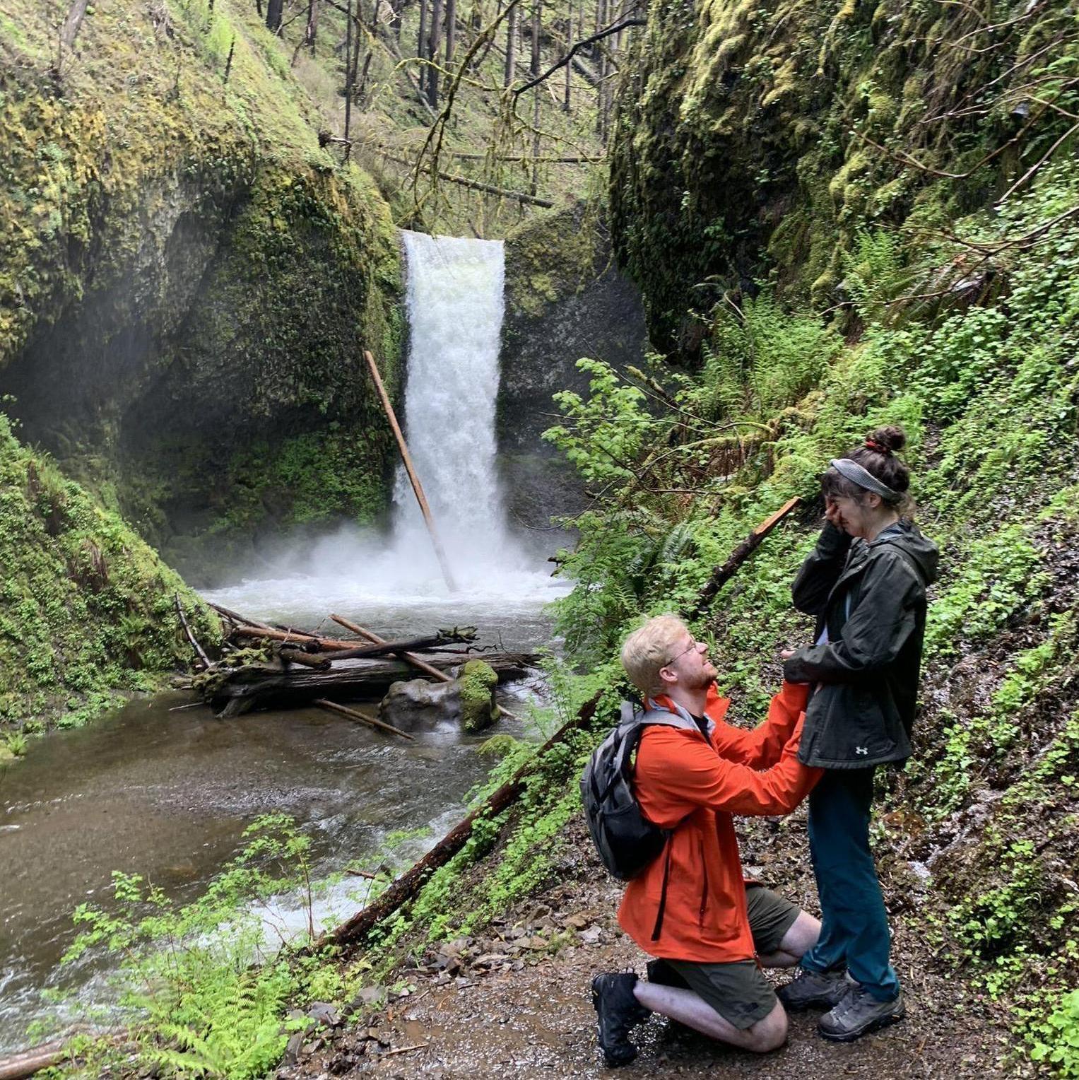 Duncan proposing while hiking at near Multnomah Falls in Oregon.