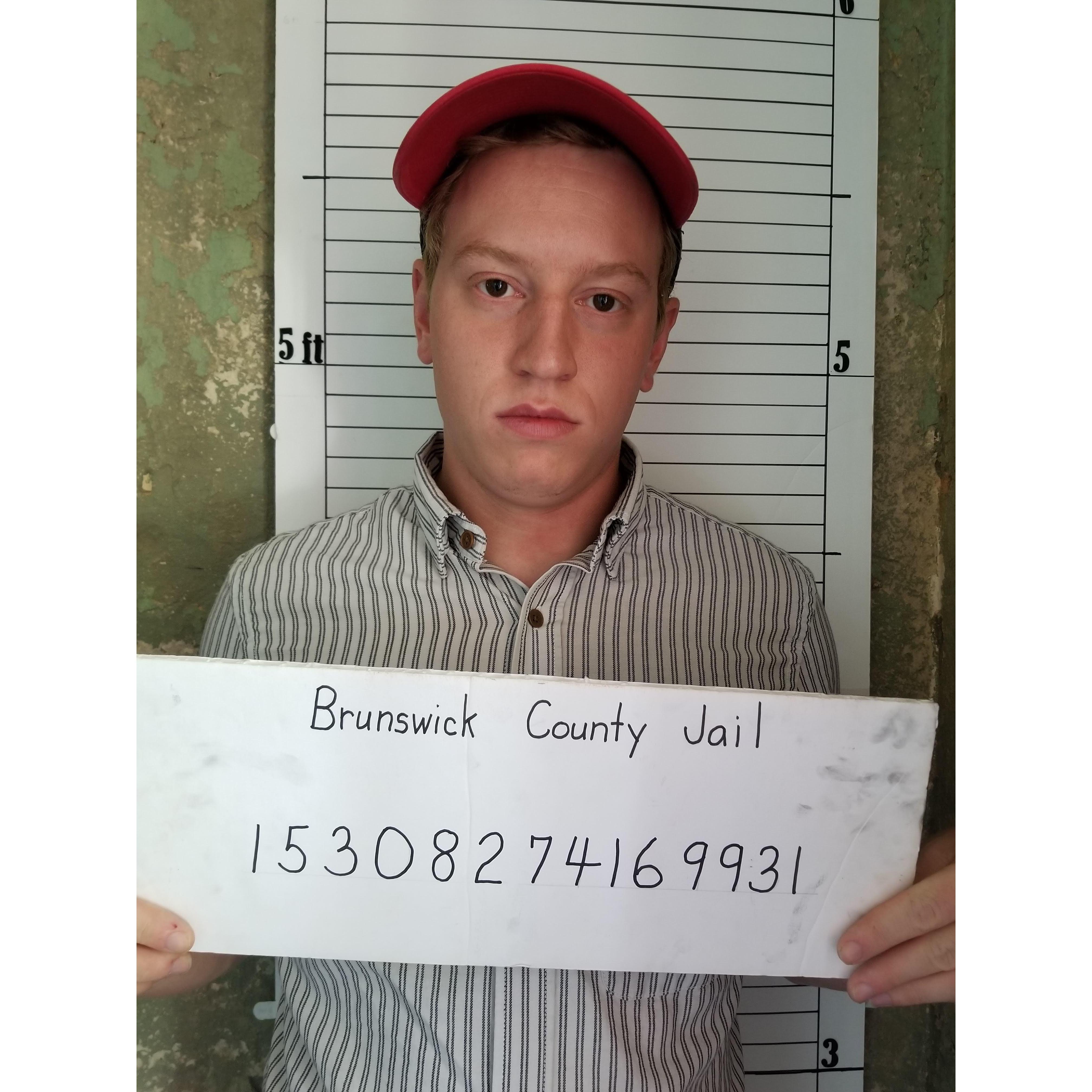 Noah's mugshot at the Brunswick County Jail museum